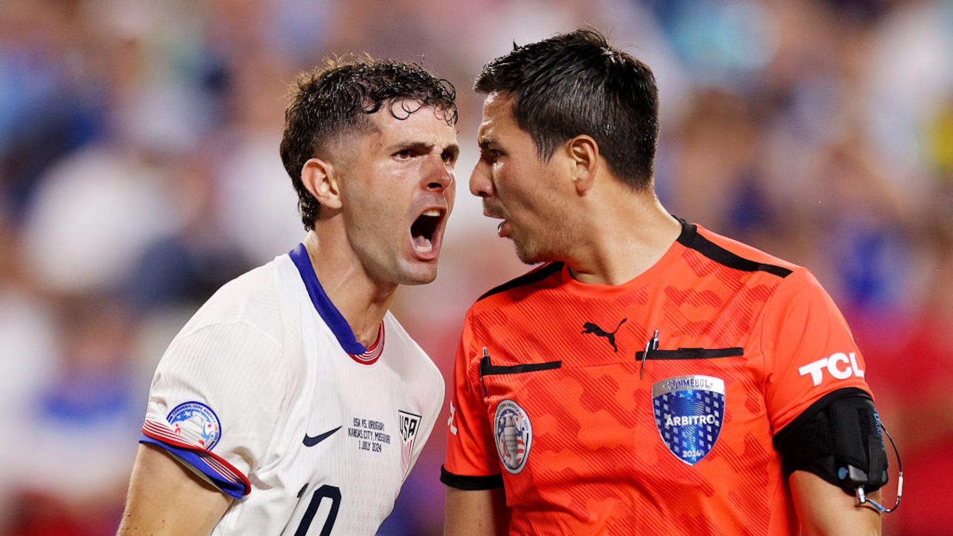Christian Pulisic #10 of the United States yells at referee Kevin Ortega during the second half against Uruguay at GEHA Field at Arrowhead Stadium on July 01, 2024 in Kansas City, Missouri.