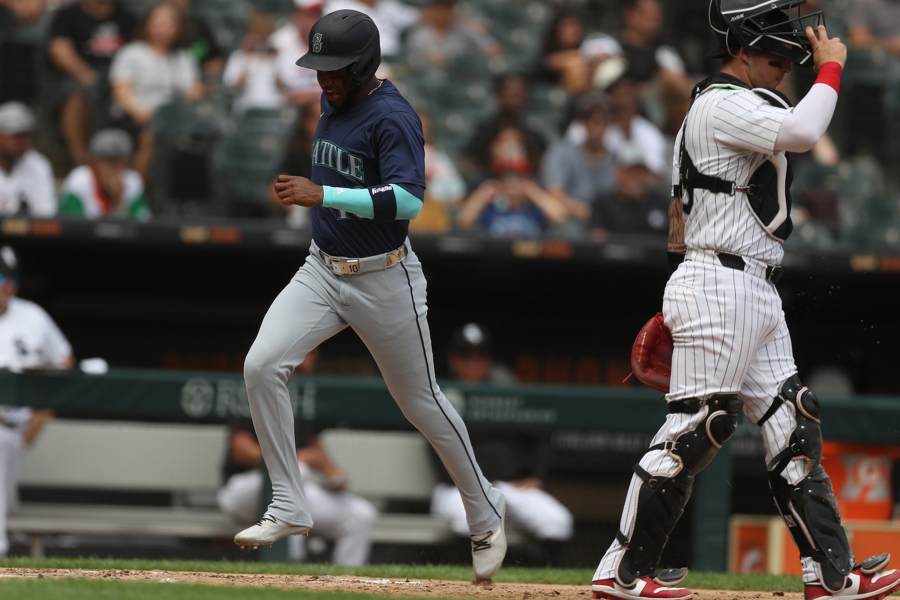 CHICAGO, IL - JULY 28: Victor Robles #10 of the Seattle Mariners scores during the fourth inning against the Chicago White Sox on July 28, 2024 at Guaranteed Rate Field in Chicago, Illinois.