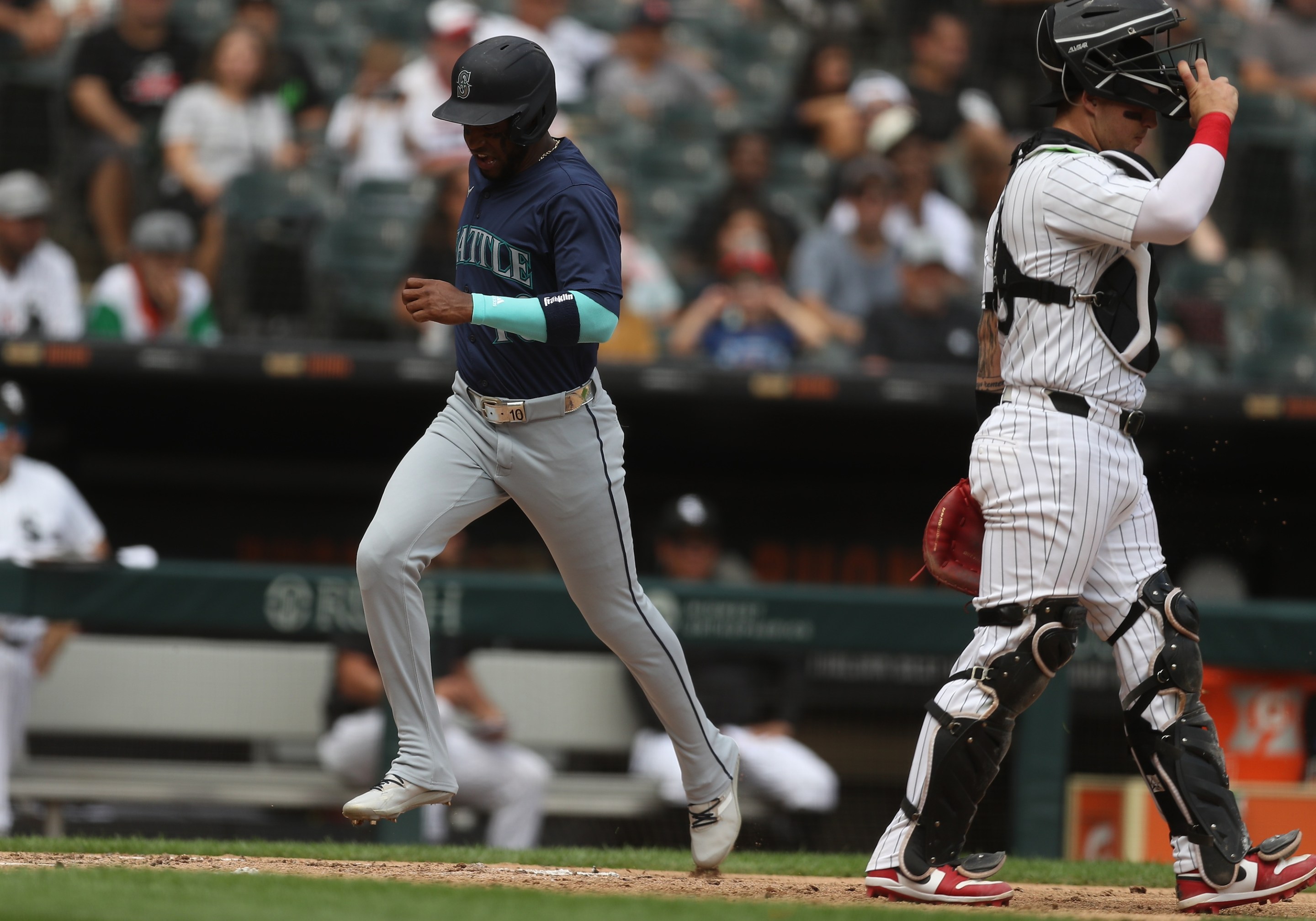 CHICAGO, IL - JULY 28: Victor Robles #10 of the Seattle Mariners scores during the fourth inning against the Chicago White Sox on July 28, 2024 at Guaranteed Rate Field in Chicago, Illinois.