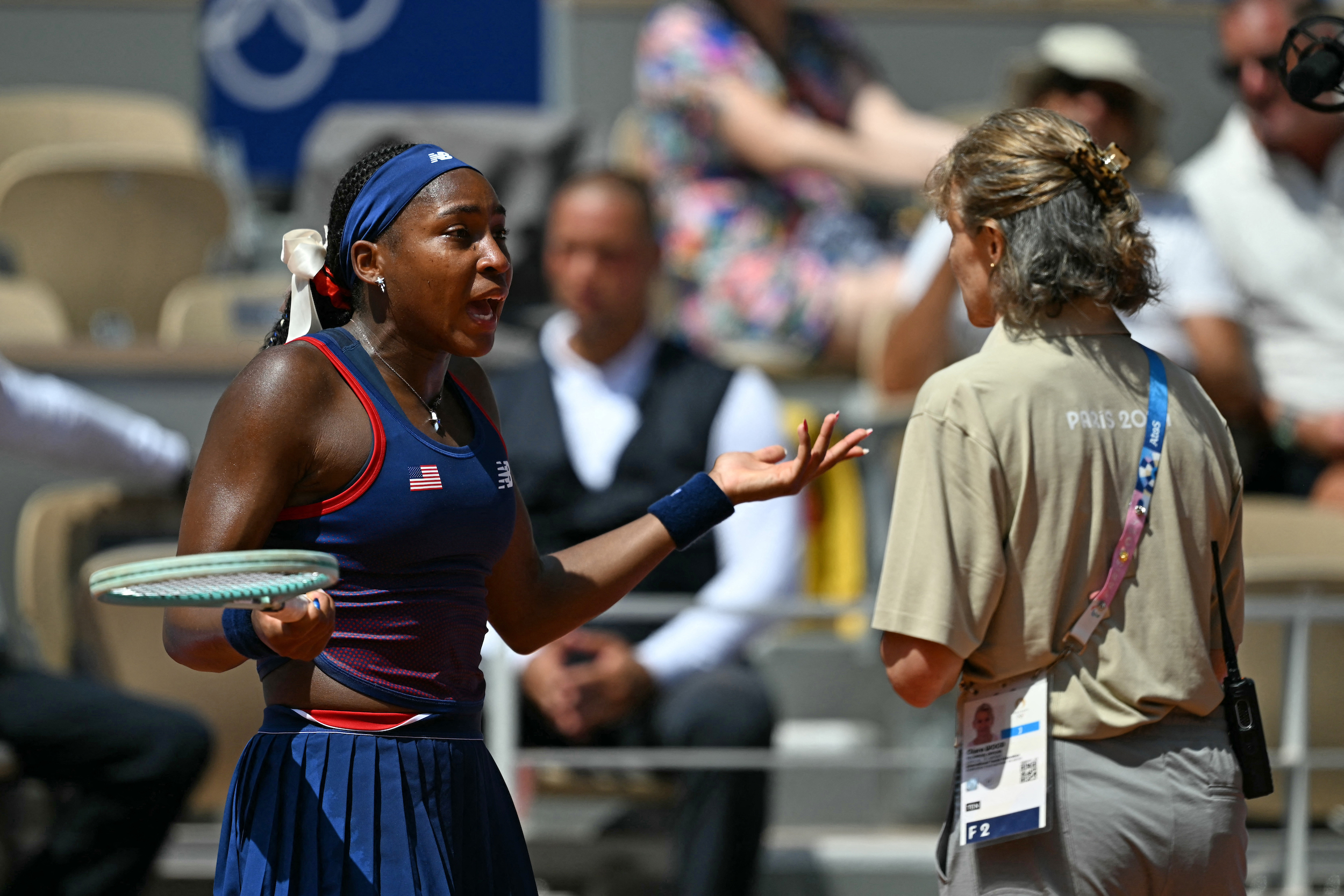 US' Coco Gauff speaks with an official after a call goes against her while playing Croatia's Donna Vekic during their women's singles third round tennis match on Court Philippe-Chatrier at the Roland-Garros Stadium during the Paris 2024 Olympic Games, in Paris on July 30, 2024.