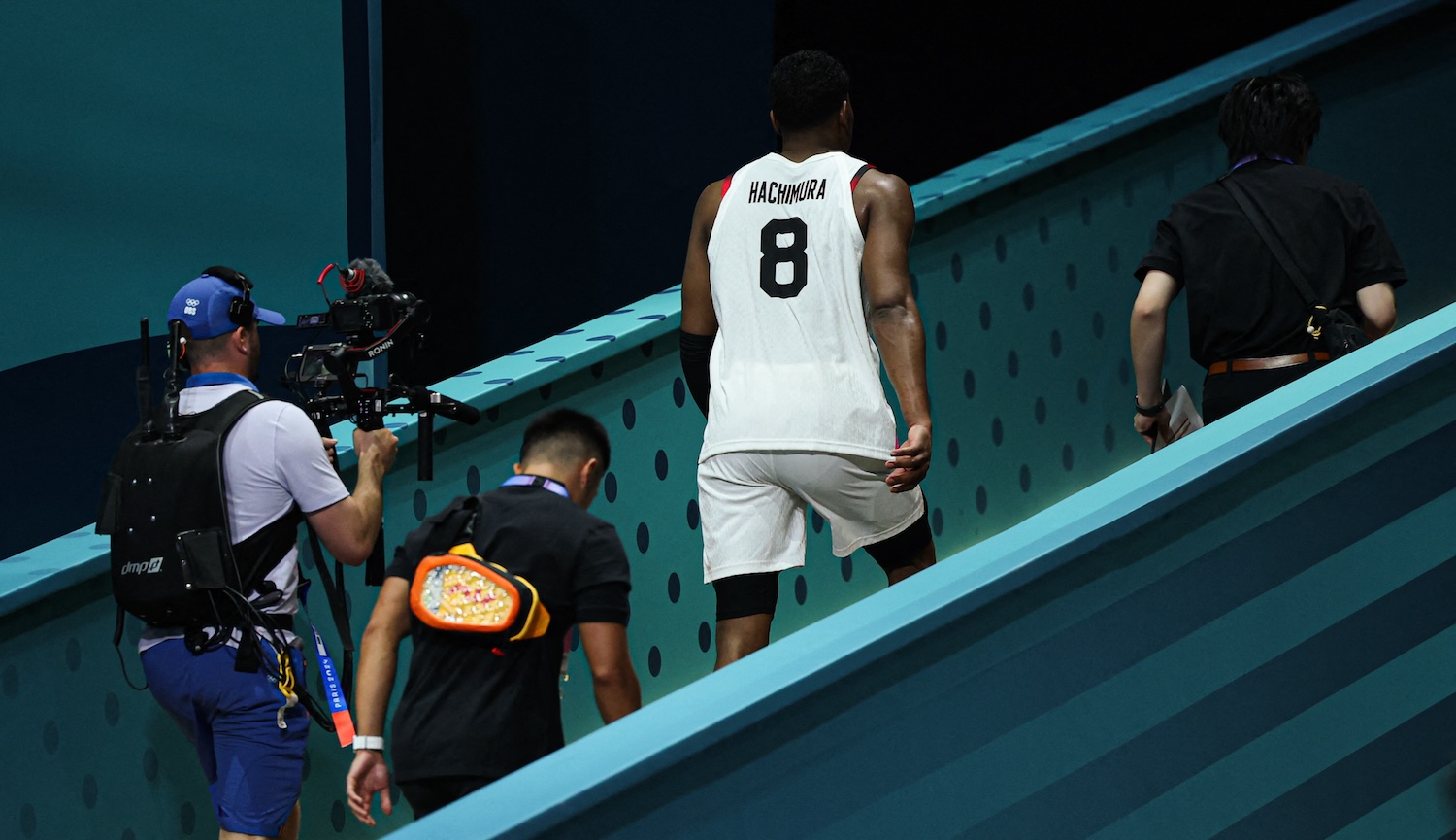 Japan's #08 Rui Hachimura leaves the court after being sent off for committing to successive unsporting fouls in the men's preliminary round group B basketball match between Japan and France during the Paris 2024 Olympic Games at the Pierre-Mauroy stadium in Villeneuve-d'Ascq, northern France, on July 30, 2024.