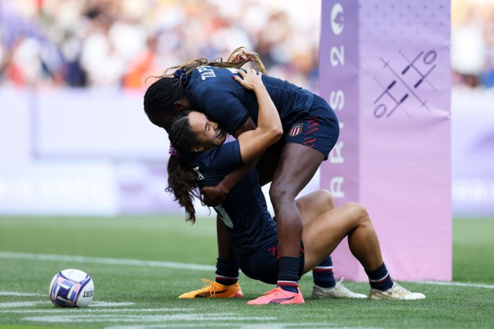 lex Sedrick #8 of Team United States celebrates with Naya Tapper #7 of Team United States after scoring her team's second and winning try during the Women's Rugby Sevens Bronze medal match between Team United States and Team Australia on day four of the Olympic Games Paris 2024 at Stade de France on July 30, 2024 in Paris, France.