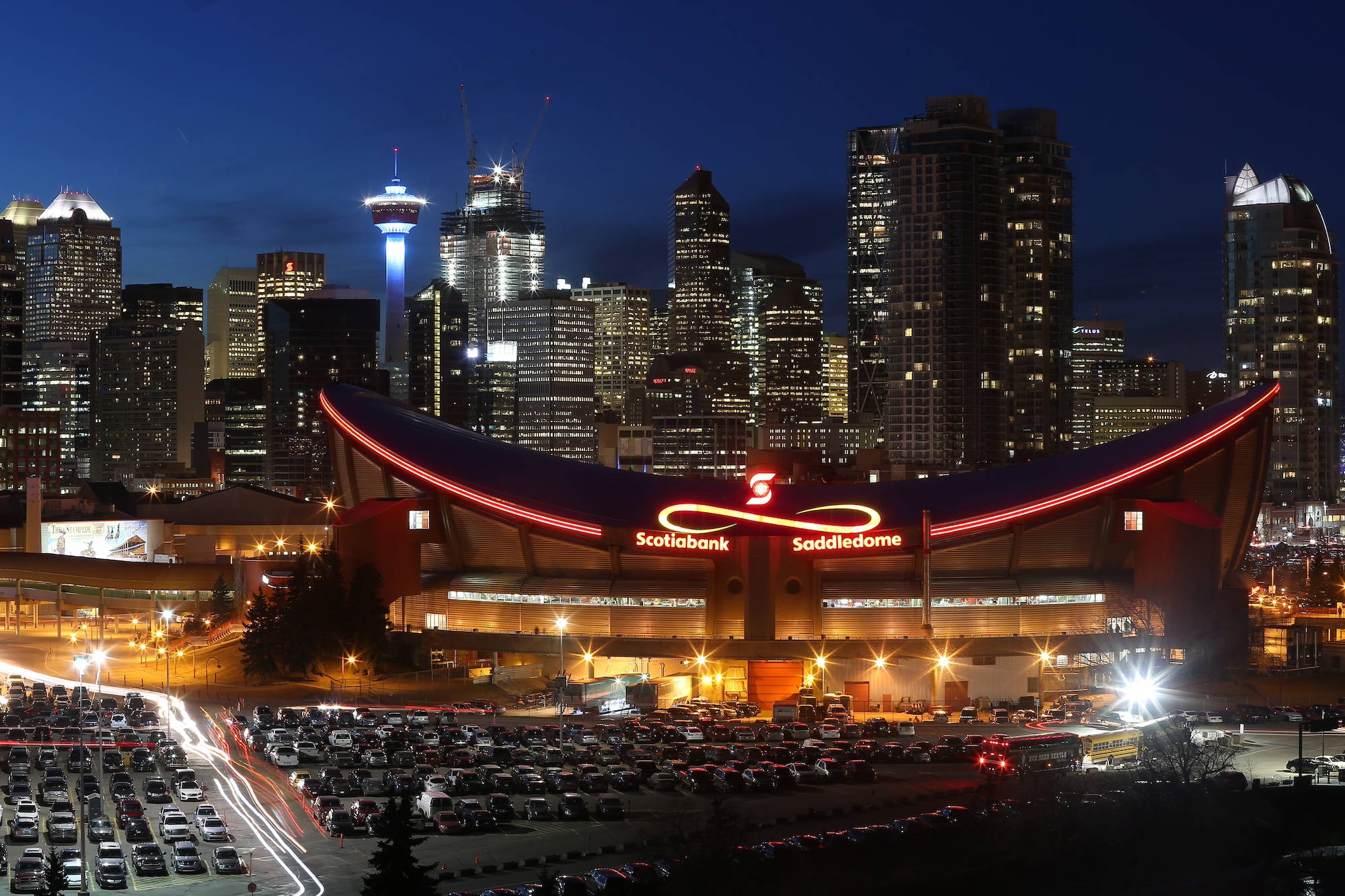 CALGARY, CANADA - FEBRUARY 25: A view of the exterior of the Scotiabank Saddledome home of the NHL’s Calgary Flames with the city skyline in the background on February 25, 2016 in Calgary, Alberta. (Photo by Tom Szczerbowski/Getty Images) *** Local Caption ***