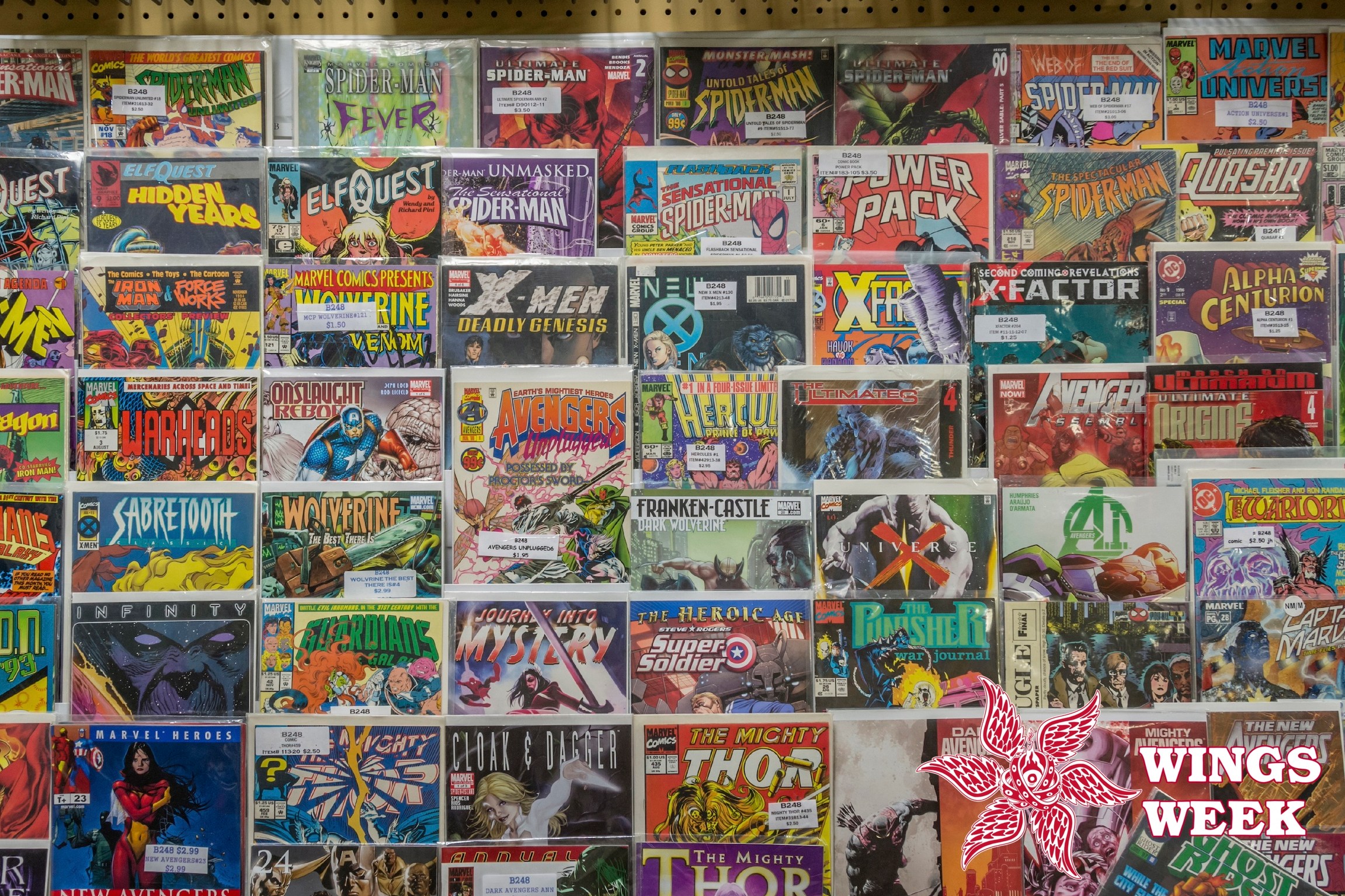Rack of comic books and toys for sale at a flea market. (Photo by: Education Images/Universal Images Group via Getty Images)
