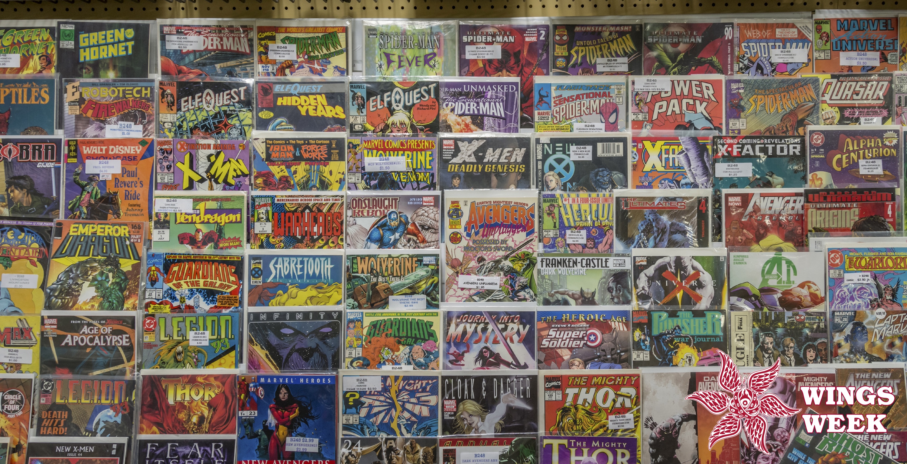 Rack of comic books and toys for sale at a flea market. (Photo by: Education Images/Universal Images Group via Getty Images)