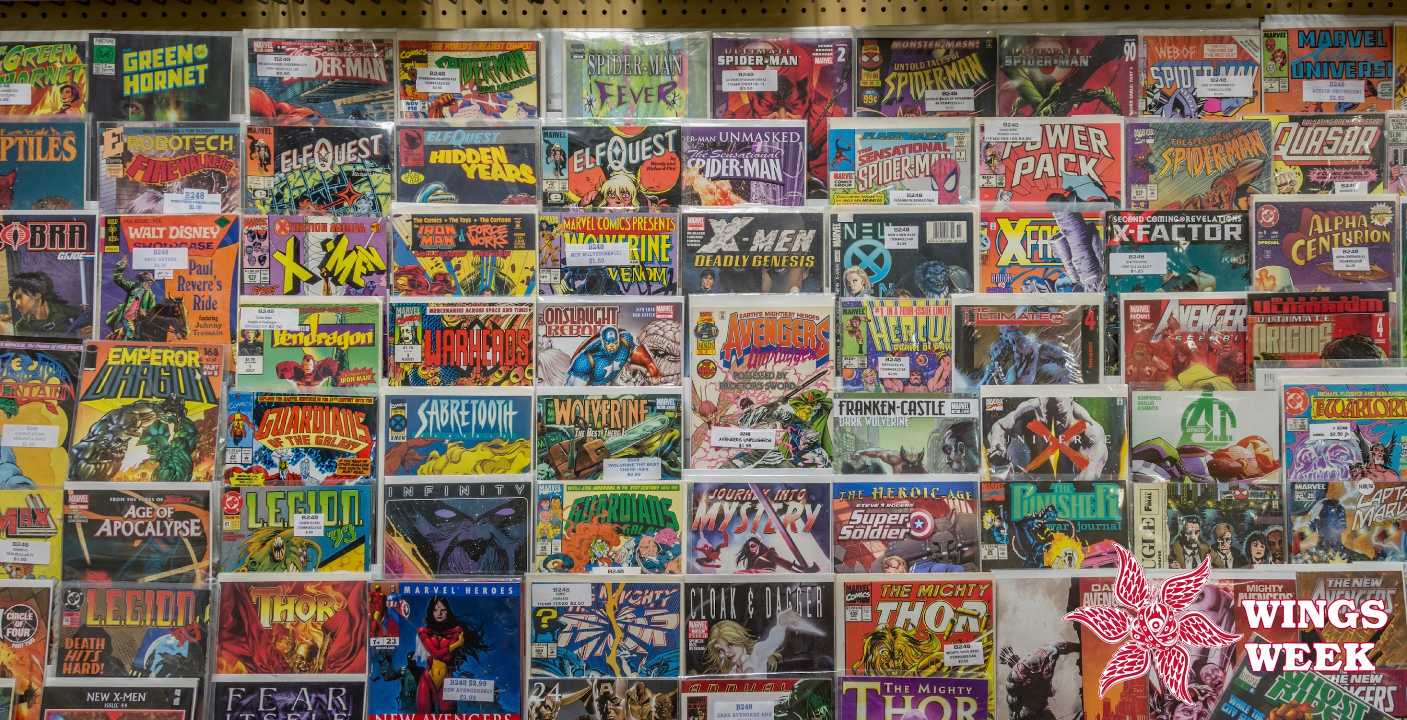 Rack of comic books and toys for sale at a flea market. (Photo by: Education Images/Universal Images Group via Getty Images)