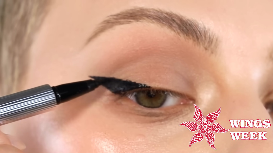 winged eyeliner tutorial screenshot with wings week logo