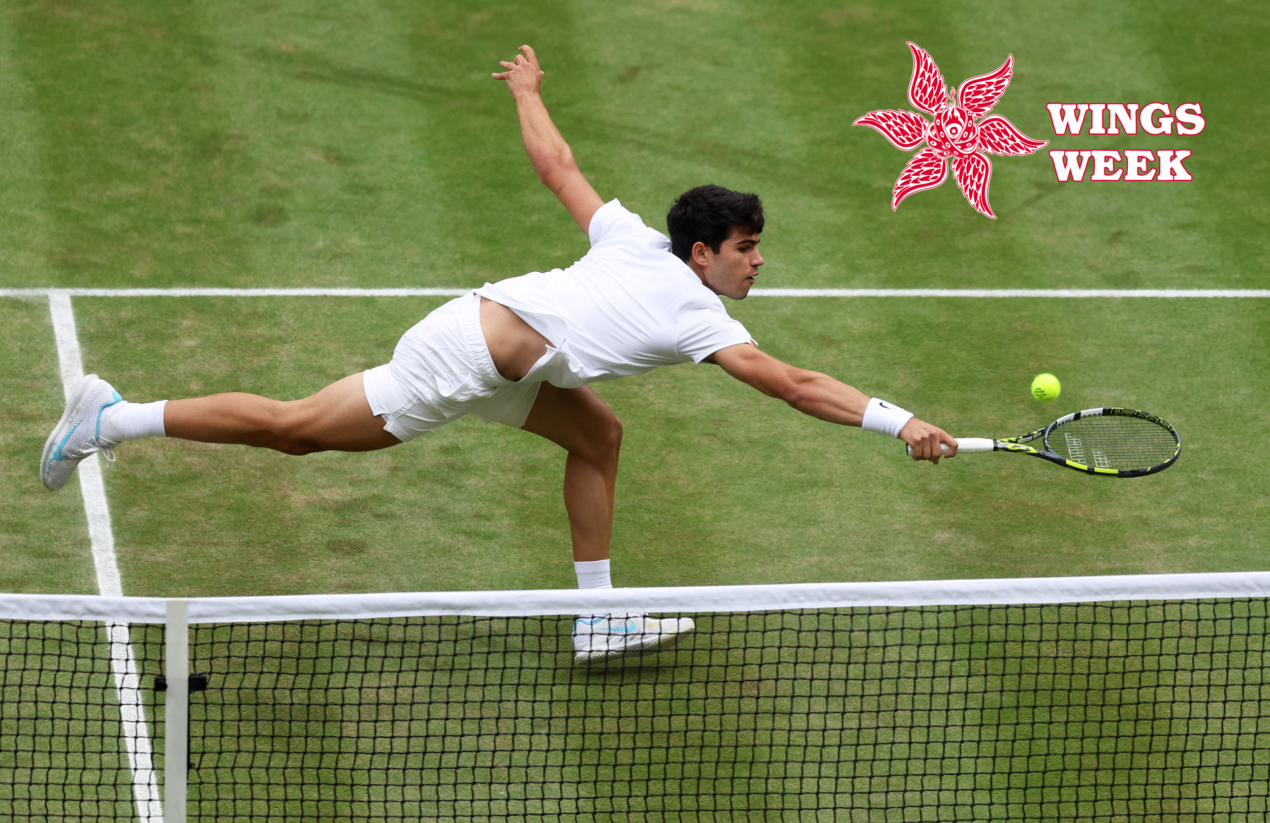 LONDON, ENGLAND - JULY 12: Carlos Alcaraz of Spain stretches to play a backhand volley against Daniil Medvedev in the Men's Singles Semi-Final match during day twelve of The Championships Wimbledon 2024 at All England Lawn Tennis and Croquet Club on July 12, 2024 in London, England. (Photo by Clive Brunskill/Getty Images)