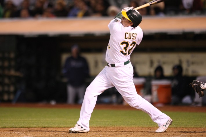 Jack Cust taking a big swing in a game with the Oakland Athletics.