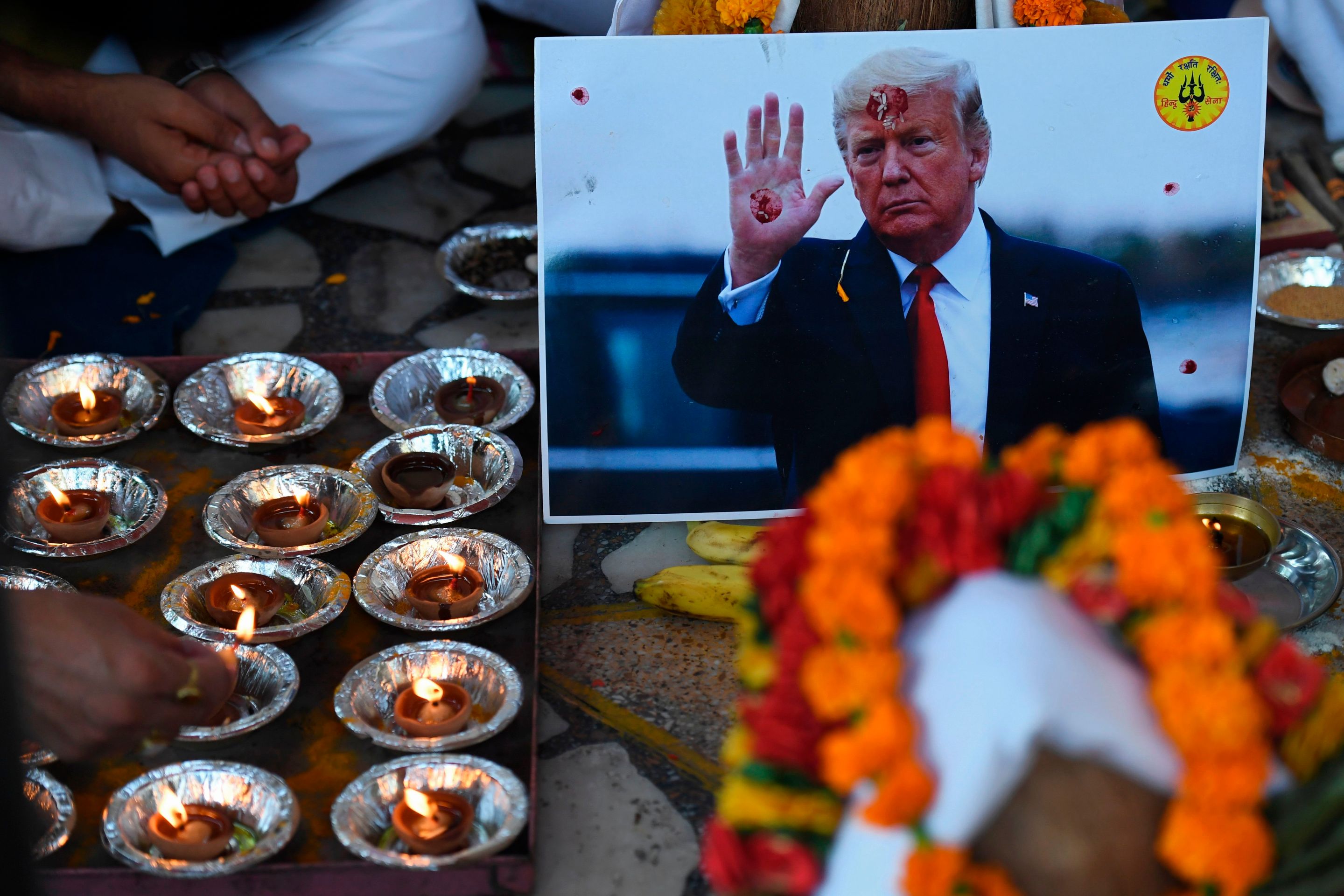 A picture of US President Donald Trump is seen during a prayer ceremony by the activists of Hindu Sena, a right wing group, for Trump's victory in the US presidential elections in New Delhi on November 3, 2020.