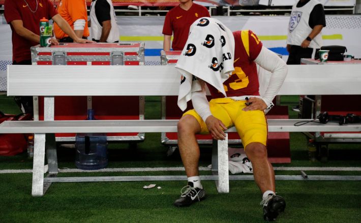 USC Trojans quarterback Caleb Williams (13) sits under a towel on the bench after the Trojans lost to Utah in the PAC-12 Championship game at Allegiant Stadium on December 2, 2022 in Las Vegas, Nevada