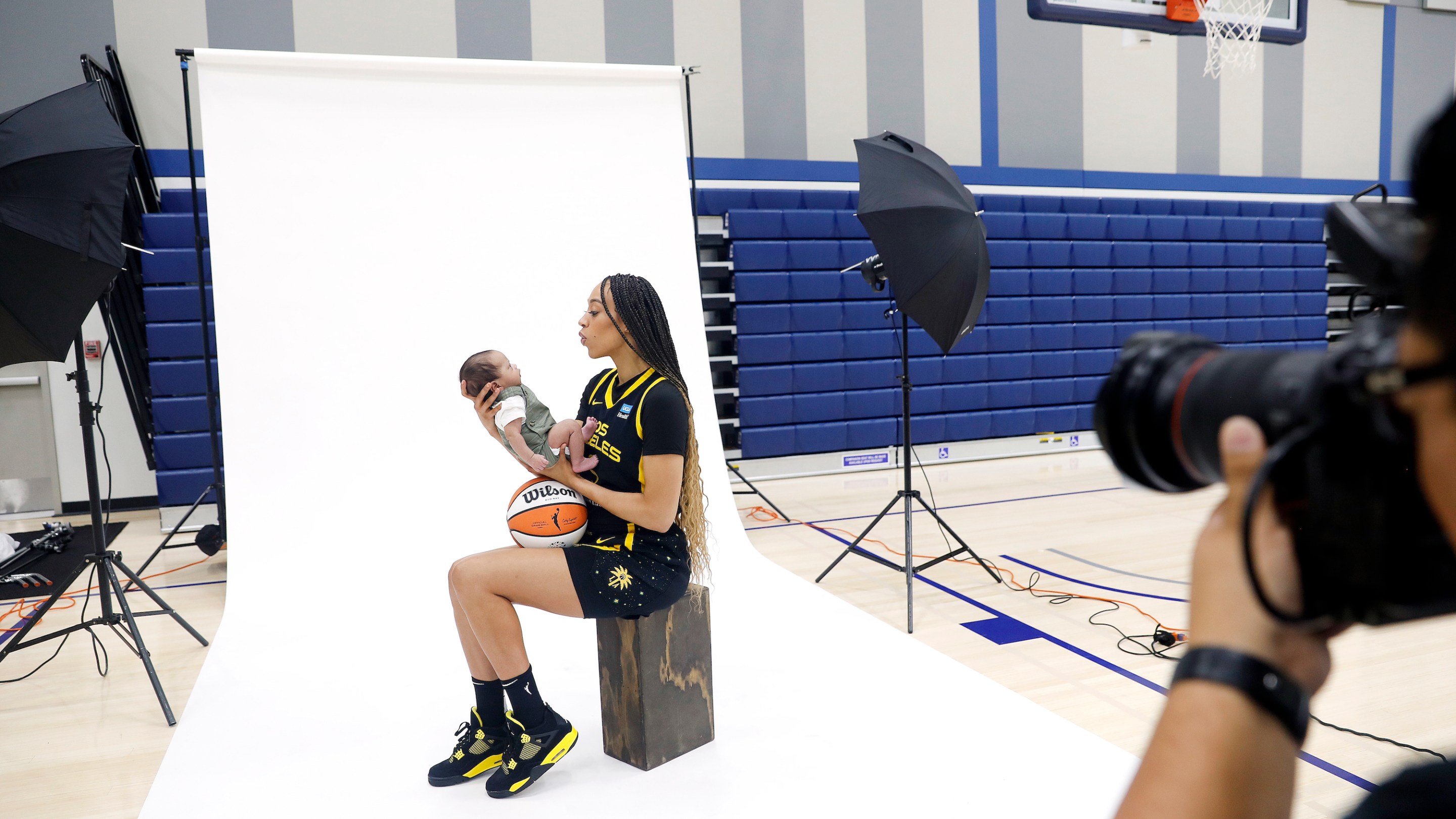 L.A. Sparks’ Dearica Hamby takes photos with her 8-week-old son Legend Scandrick during media day at El Camino College in Torrance on May 4, 2023.