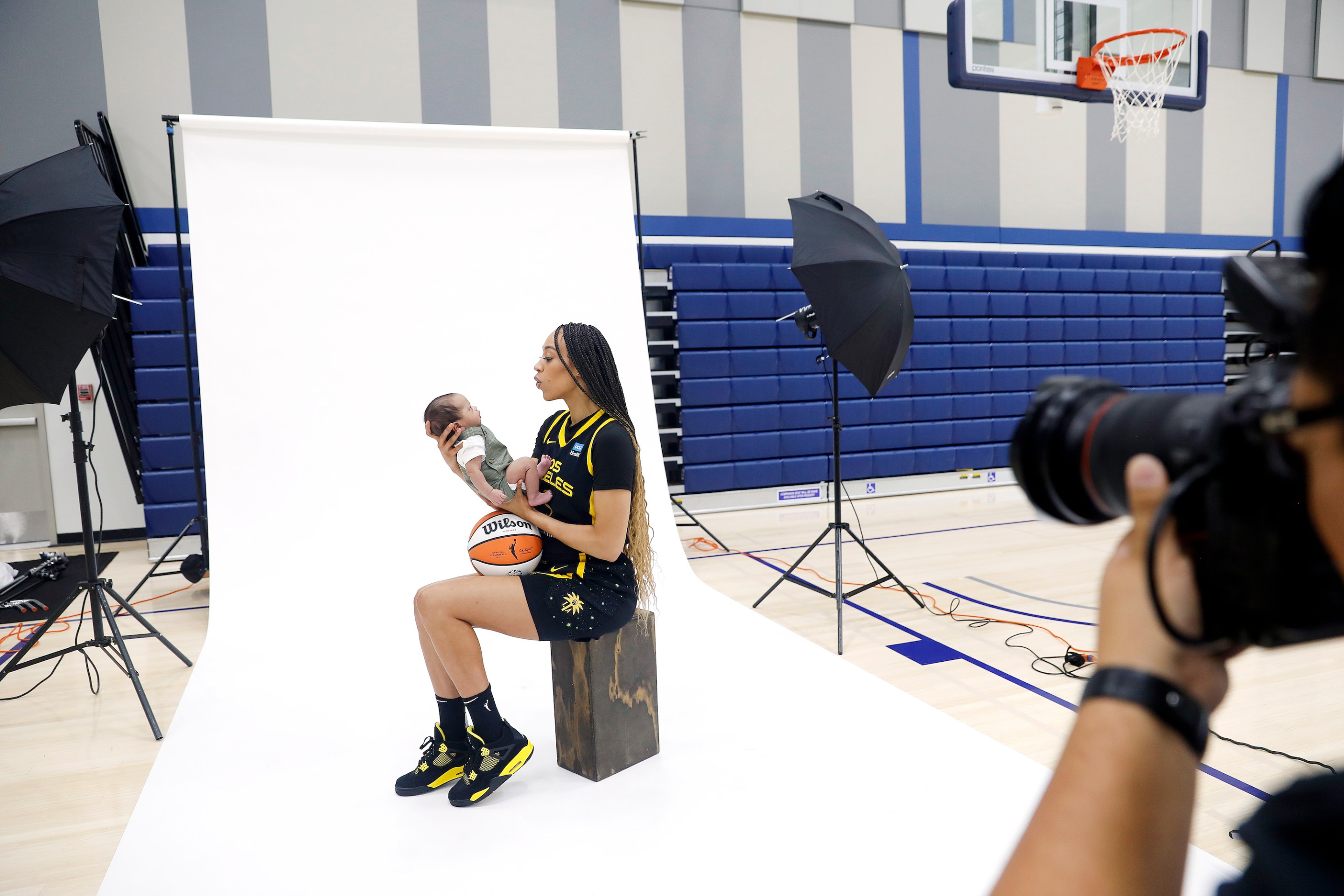 L.A. Sparks’ Dearica Hamby takes photos with her 8-week-old son Legend Scandrick during media day at El Camino College in Torrance on May 4, 2023.