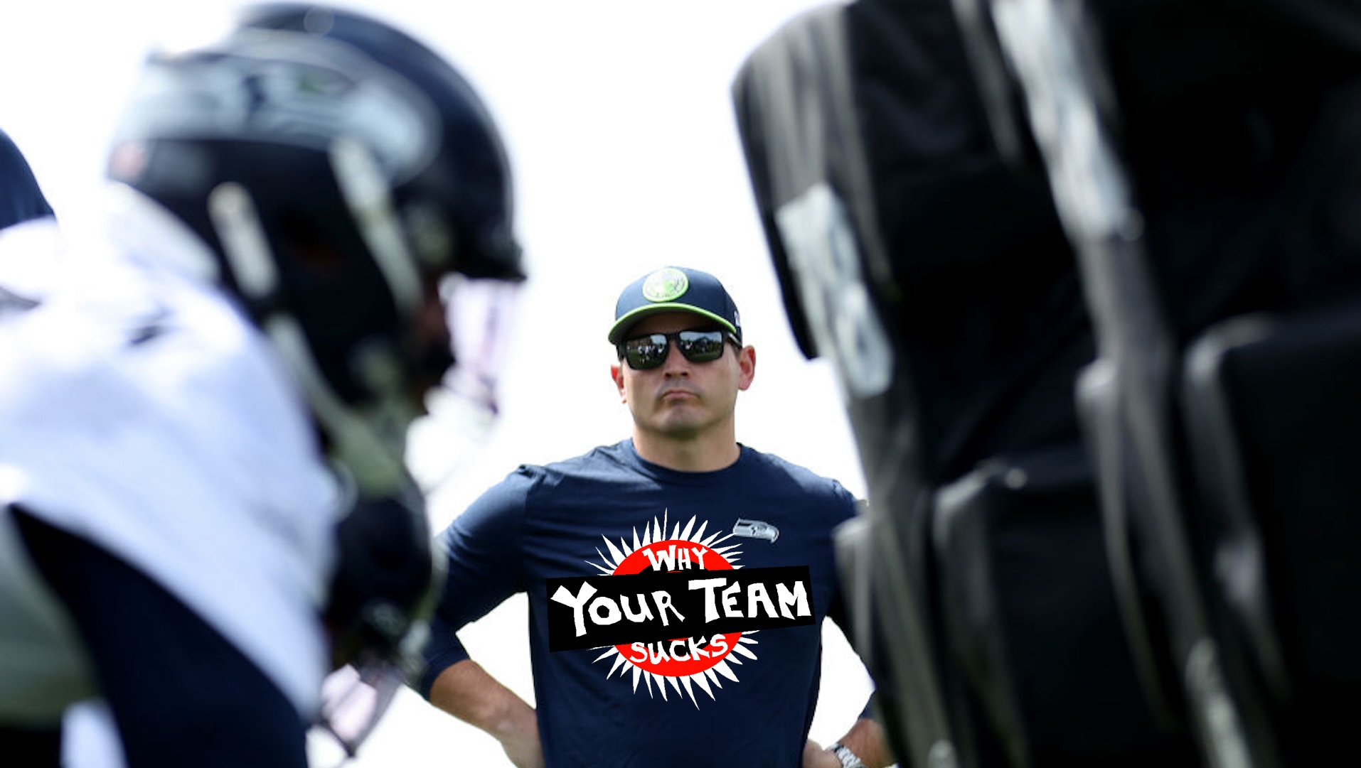 Head coach Mike Macdonald of the Seattle Seahawks watches a workout during Seattle Seahawks rookie minicamp at Virginia Mason Athletic Center on May 03, 2024 in Renton, Washington.