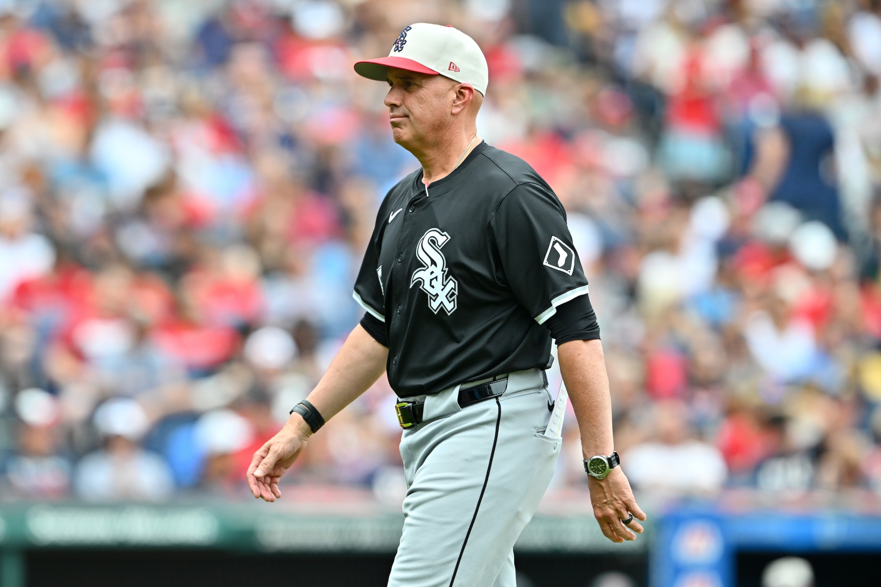 Manager Pedro Grifol of the Chicago White Sox walks back to the dugout after a pitching change during the third inning against the Cleveland Guardians on July 4, 2024 in Cleveland, Ohio.