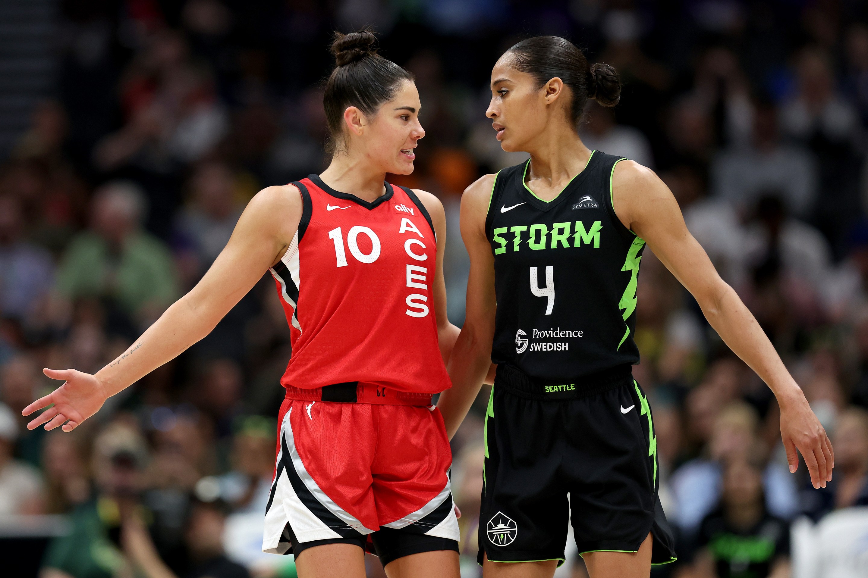 Skylar Diggins-Smith #4 of the Seattle Storm and Kelsey Plum #10 of the Las Vegas Aces talk during the second quarter at Climate Pledge Arena on July 10, 2024 in Seattle, Washington.