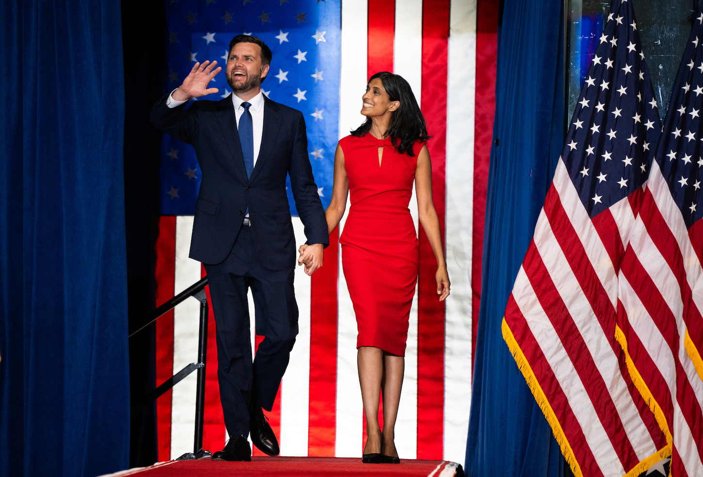 Republican vice presidential nominee U.S. Sen. J.D. Vance (R-OH) walks out with his wife Usha Vance to speak during a rally with running mate U.S. Republican Presidential nominee former President Donald Trump.