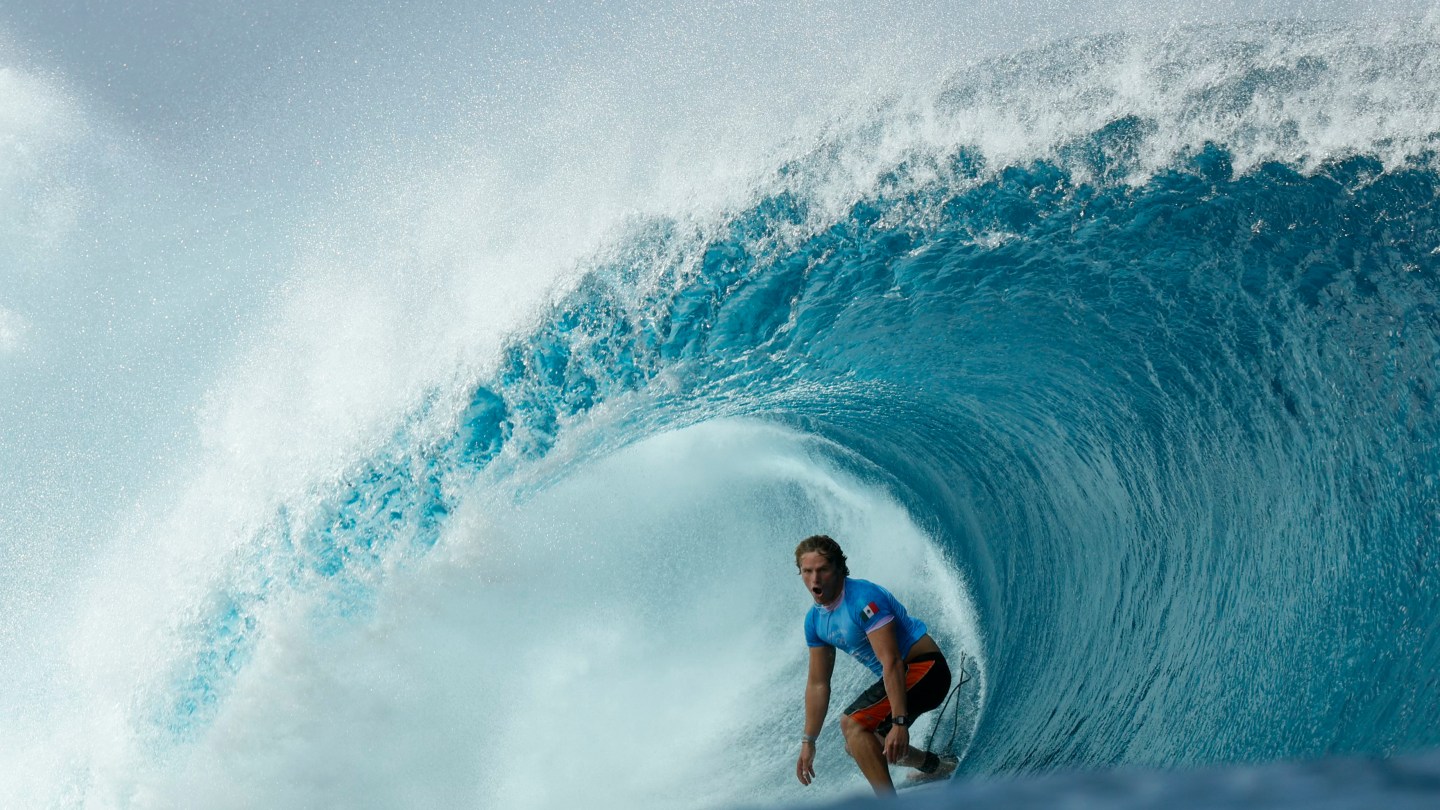 TOPSHOT - Mexico's Alan Cleland Quinonez gets a barrel in the 4th heat of the men's surfing round 3, during the Paris 2024 Olympic Games, in Teahupo'o, on the French Polynesian Island of Tahiti, on July 29, 2024.