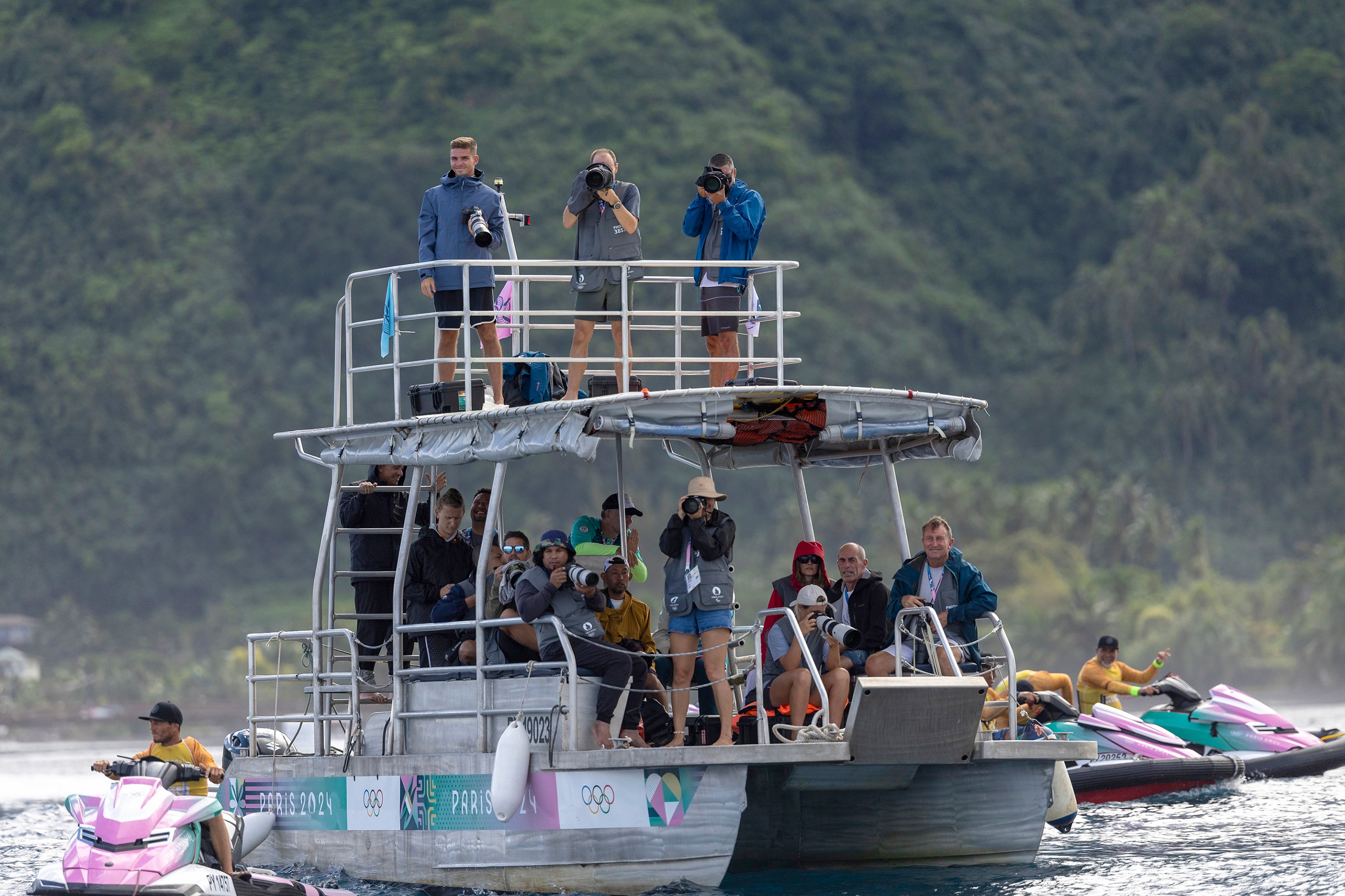 TEAHUPO'O, FRENCH POLYNESIA - JULY 28: A view of photographers on a media boat during round two of surfing on day two of the Olympic Games Paris 2024 on July 28, 2024 in Teahupo'o, French Polynesia.