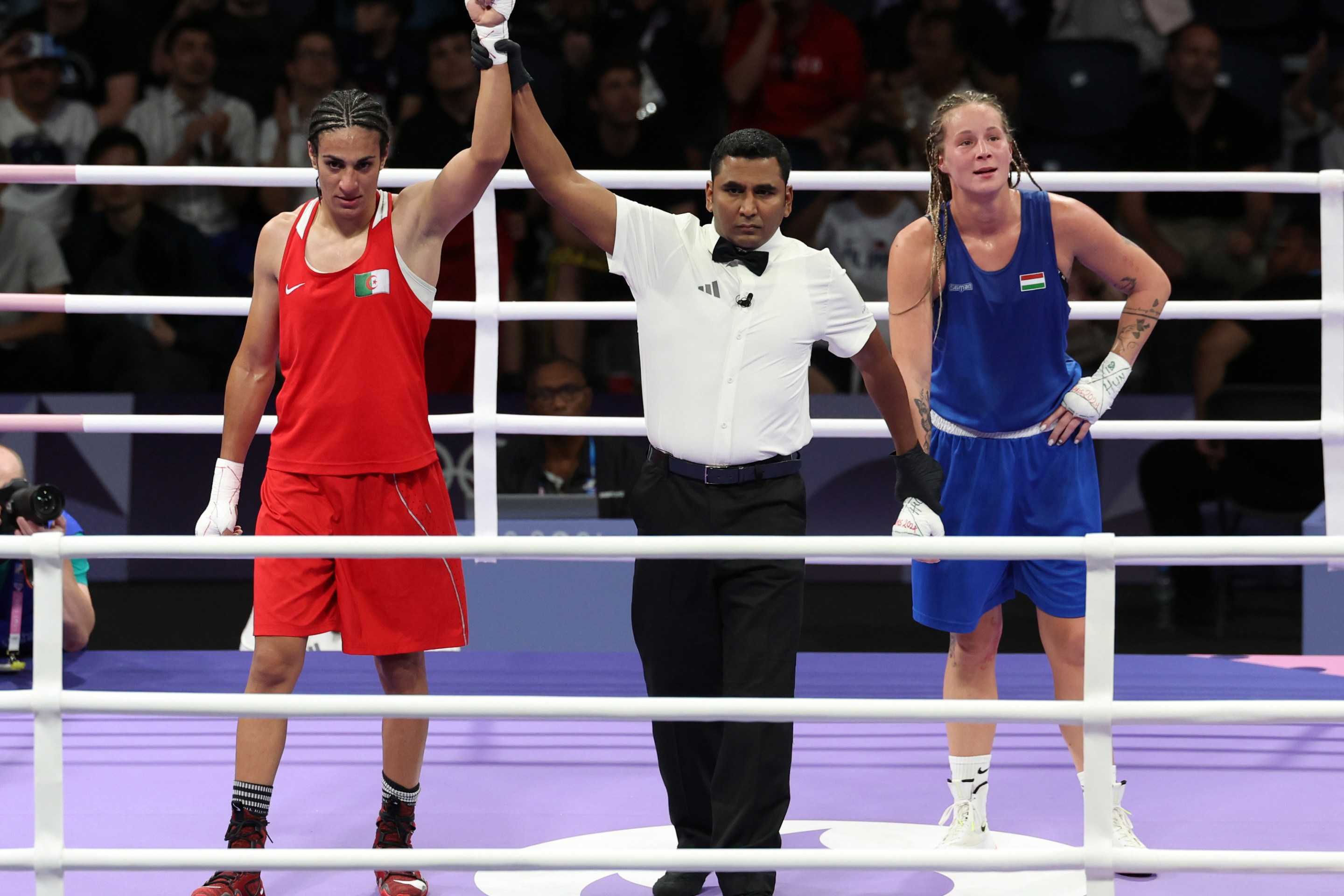 Algeria's Imane Khelif (left) following her victory over Hungary's Luca Anna Hamori in the Women's 66kg - Quarterfinal at the North Paris Arena