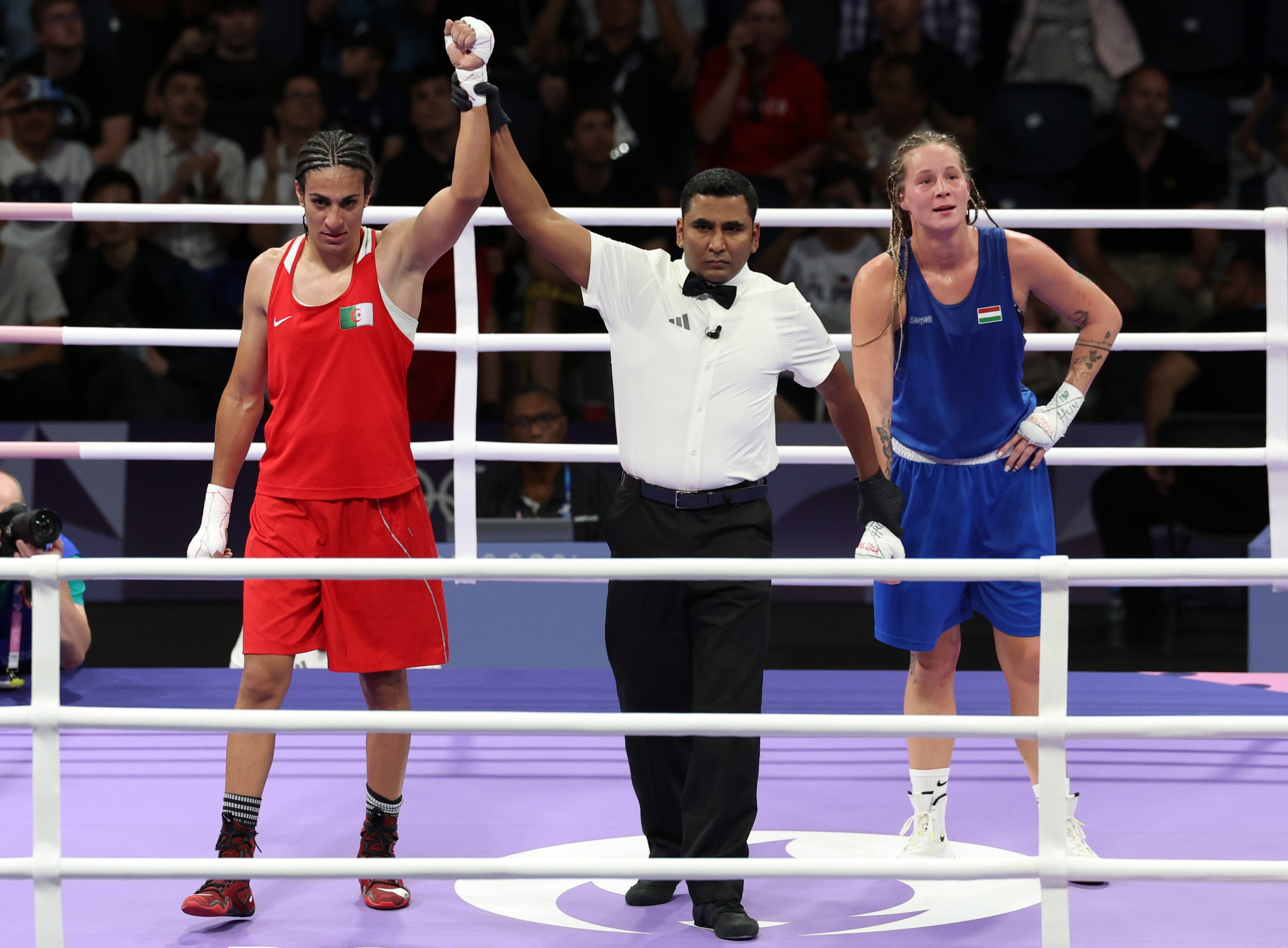 Algeria's Imane Khelif (left) following her victory over Hungary's Luca Anna Hamori in the Women's 66kg - Quarterfinal at the North Paris Arena