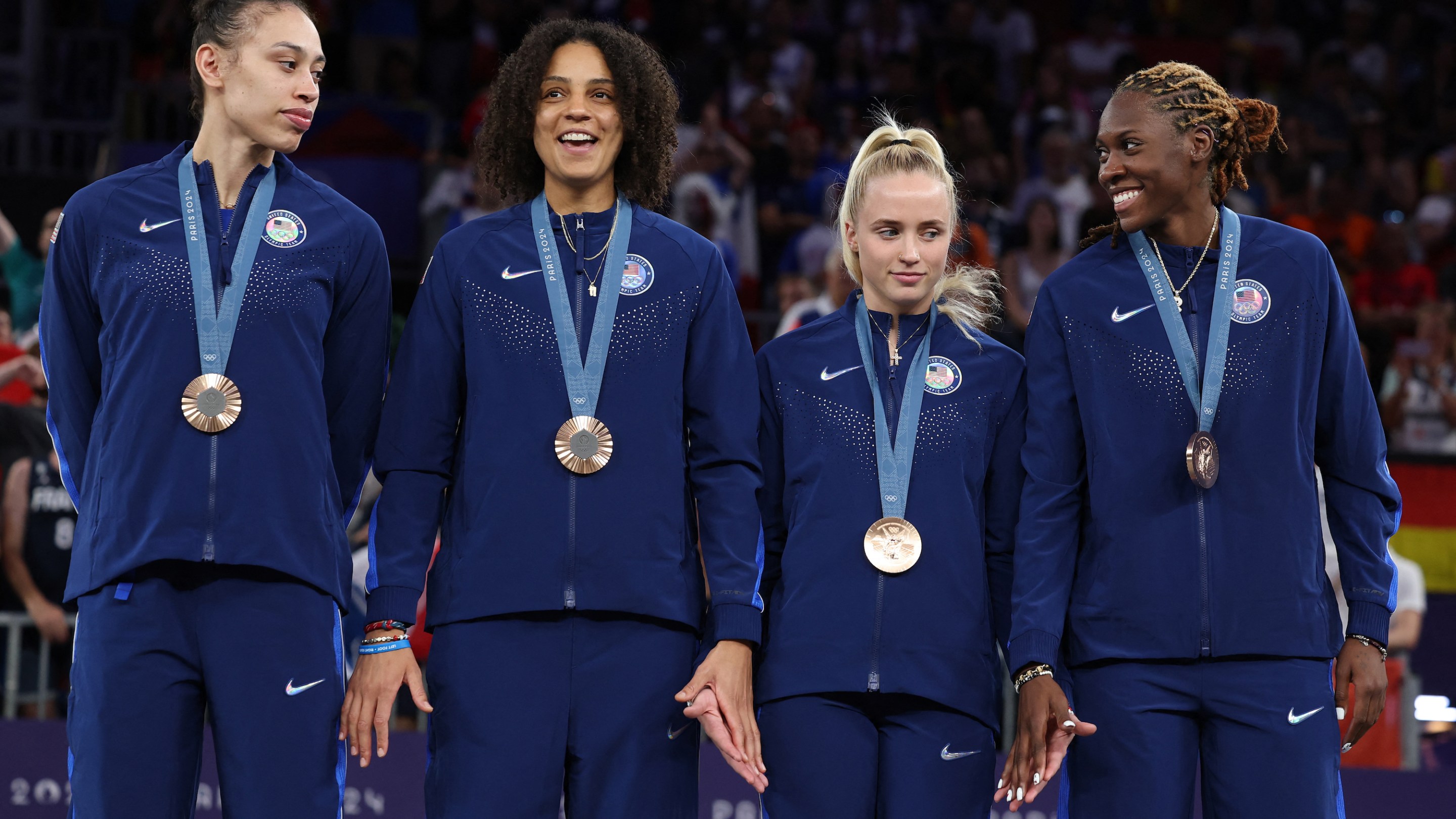 Bronze medallists USA celebrate on the podium of the women's 3x3 basketball during the Paris 2024 Olympic Games at La Concorde in Paris on August 5, 2024.