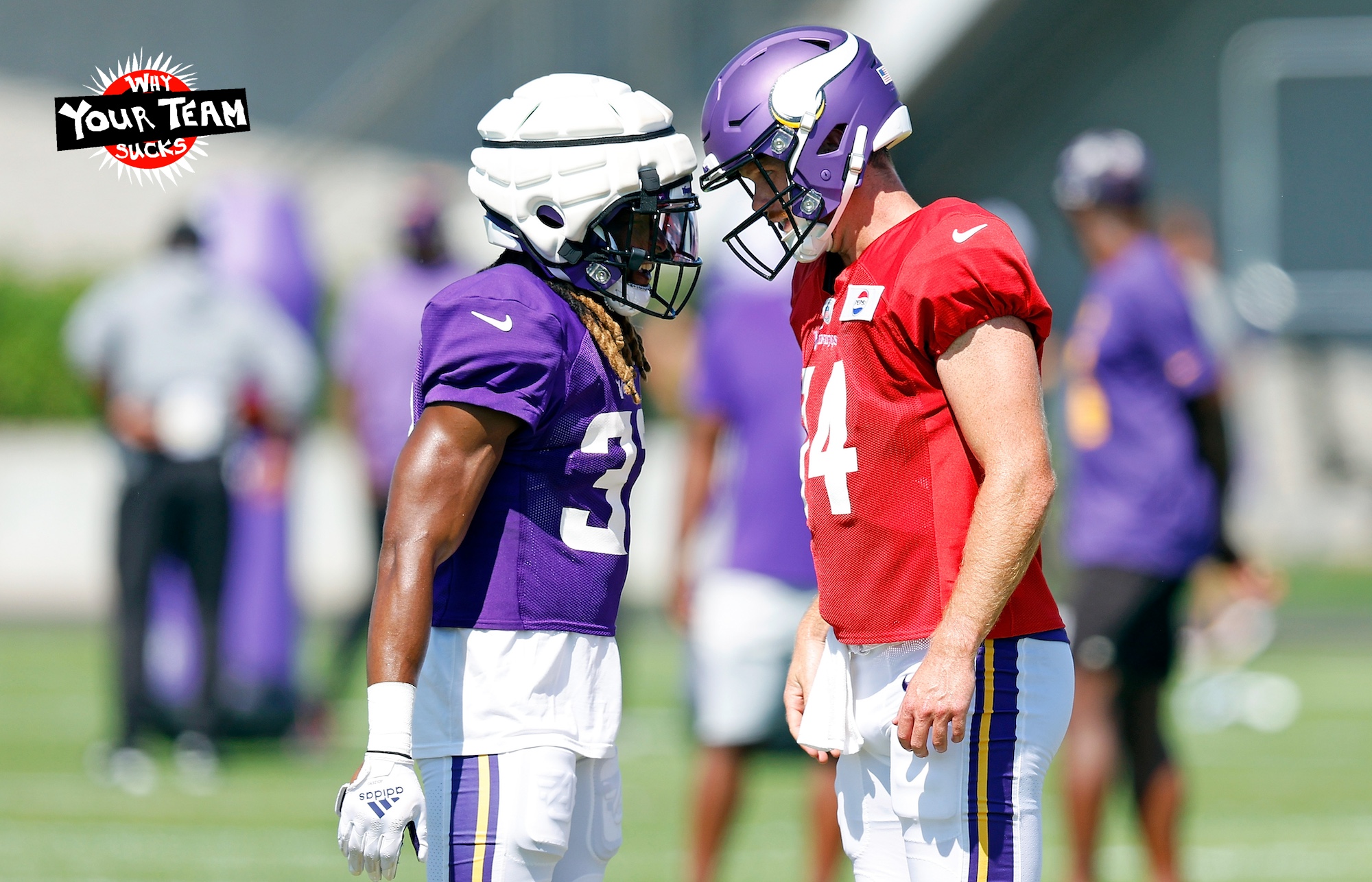 EAGAN, MINNESOTA - AUGUST 02: Aaron Jones #33 interacts with Sam Darnold #14 of the Minnesota Vikings during training camp on August 02, 2024 in Eagan, Minnesota. (Photo by David Berding/Getty Images)