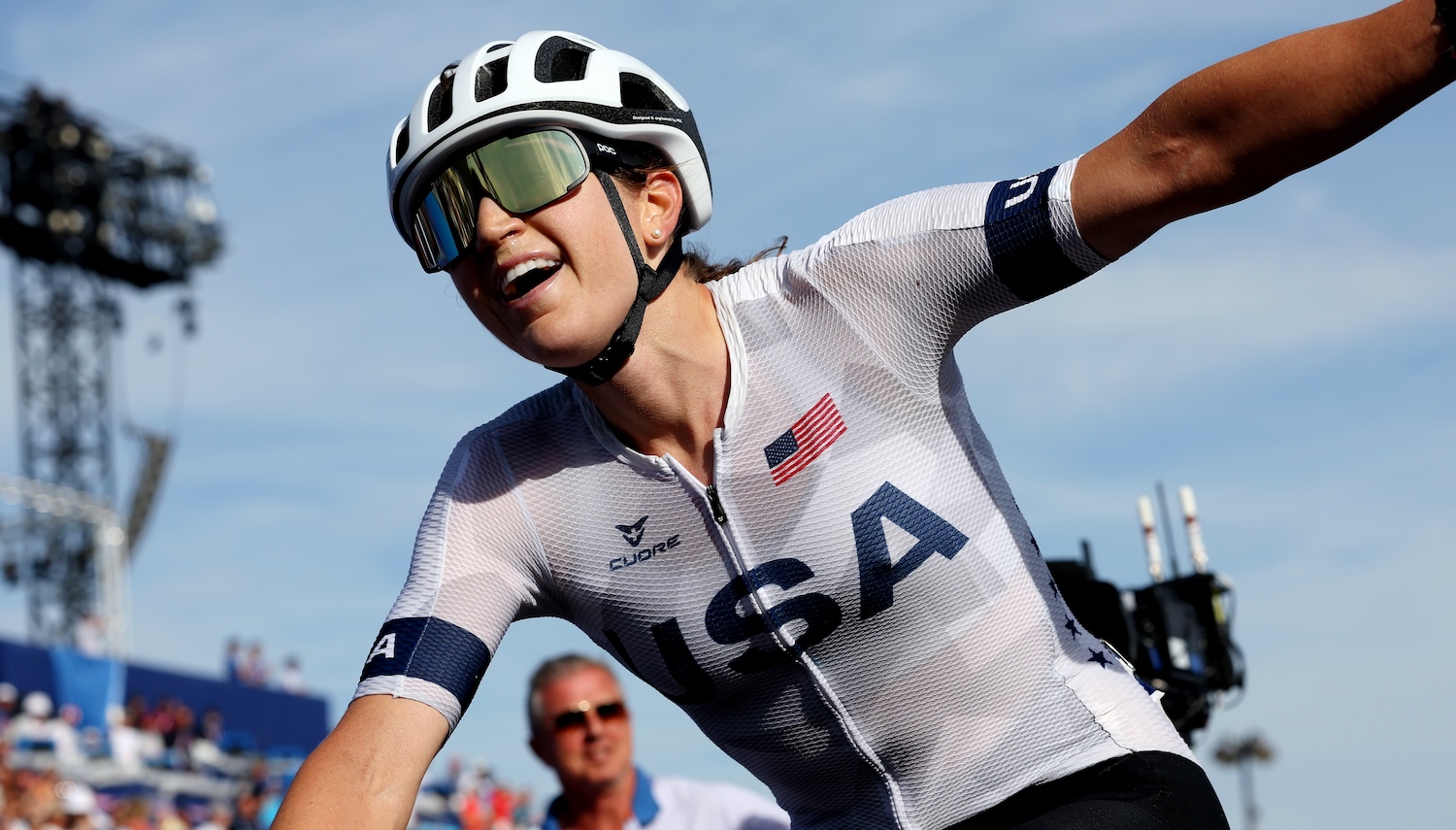 PARIS, FRANCE - AUGUST 04: Kristen Faulkner of Team United States celebrates at finish line as Gold medal winner during the Women's Road Race on day nine of the Olympic Games Paris 2024 at Trocadero on August 04, 2024 in Paris, France. (Photo by Tim de Waele/Getty Images)