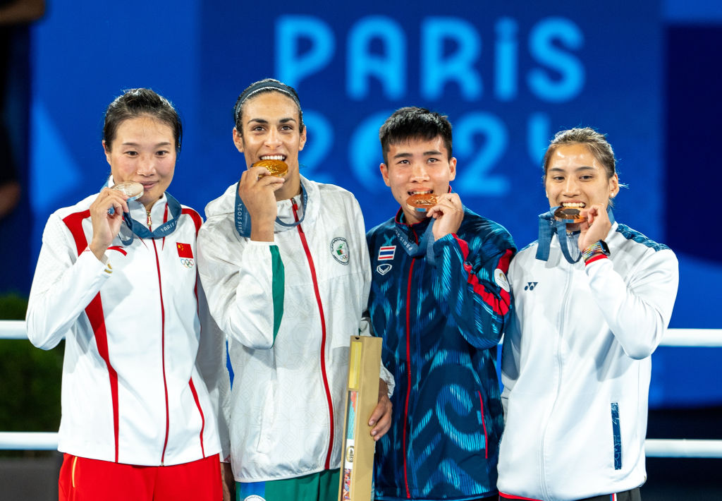 Imane Khelif and three others pose with their medals at the Olympics