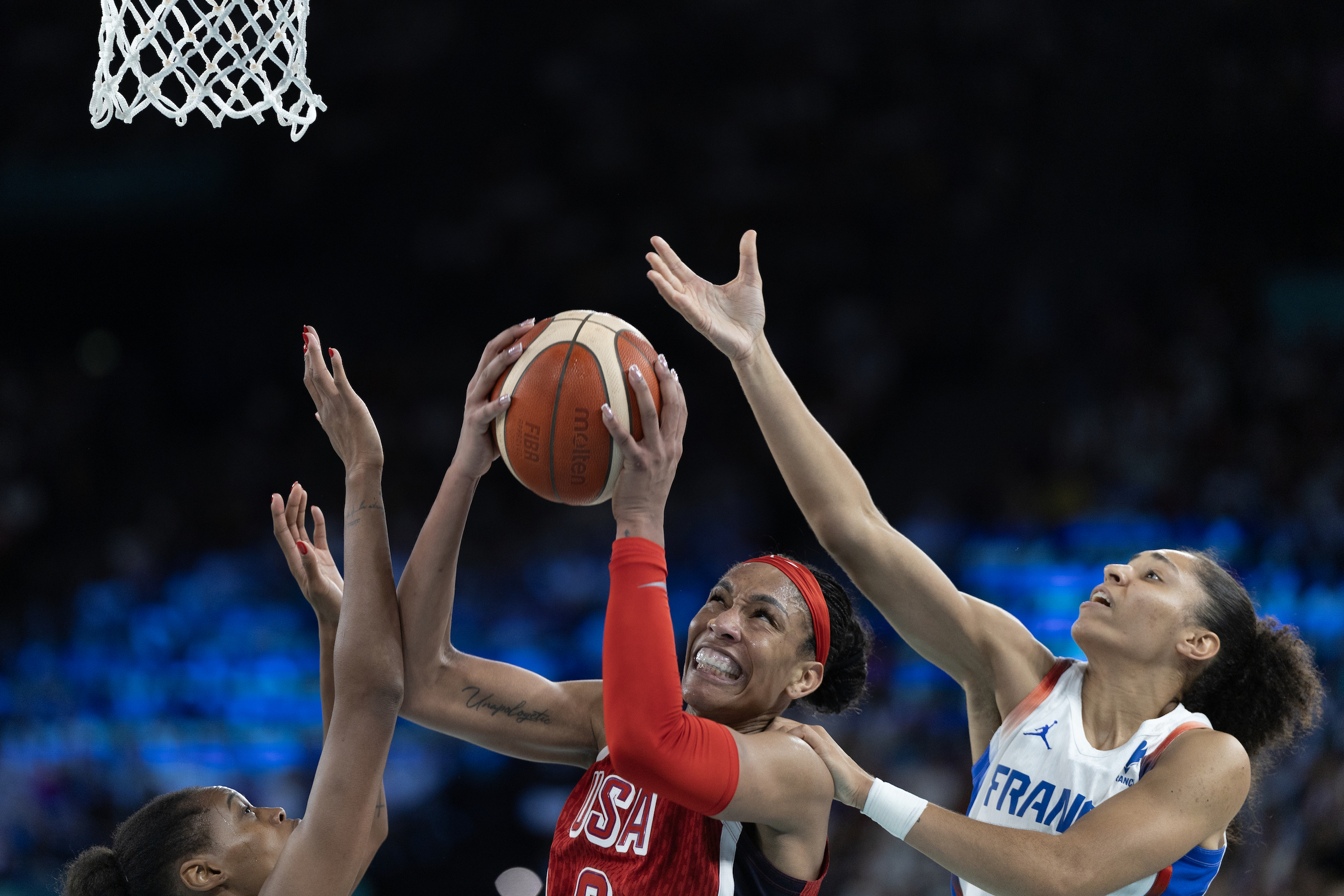 PARIS, FRANCE: AUGUST 11: A'Ja Wilson #9 of Team United States drives to the basket defended by Valeriane Ayayi #11 of Team France and Janelle Salaun #13 of Team France during the United States of America v France, Women's Basketball Gold Medal Game at the Bercy Arena during the Paris 2024 Summer Olympic Games on August 11th, 2024 in Paris, France. (Photo by Tim Clayton/Corbis via Getty Images)