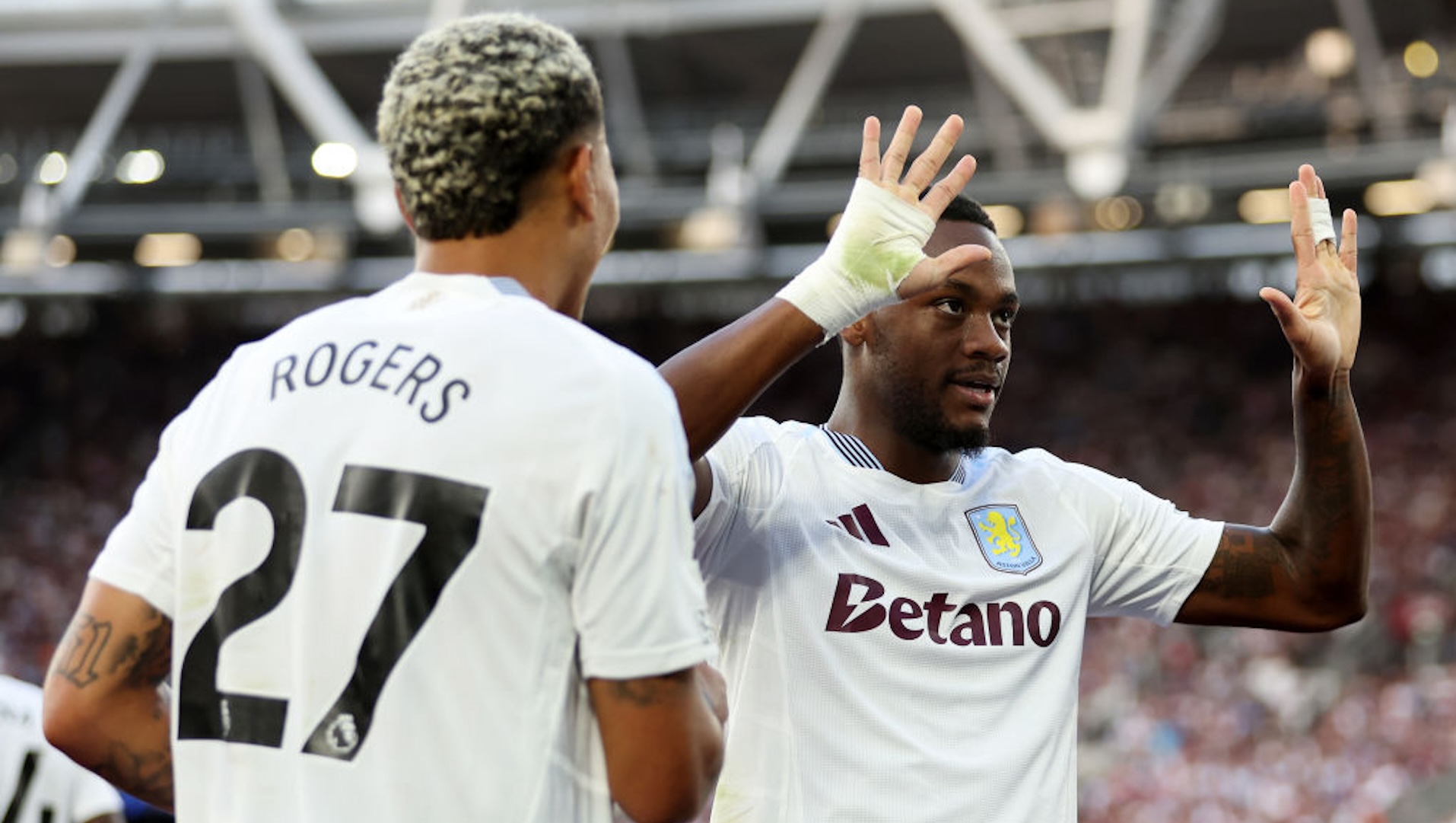 Jhon Duran of Aston Villa celebrates scoring his team's second goal with teammate Morgan Rogers during the Premier League match between West Ham United FC and Aston Villa FC at London Stadium on August 17, 2024 in London, England.