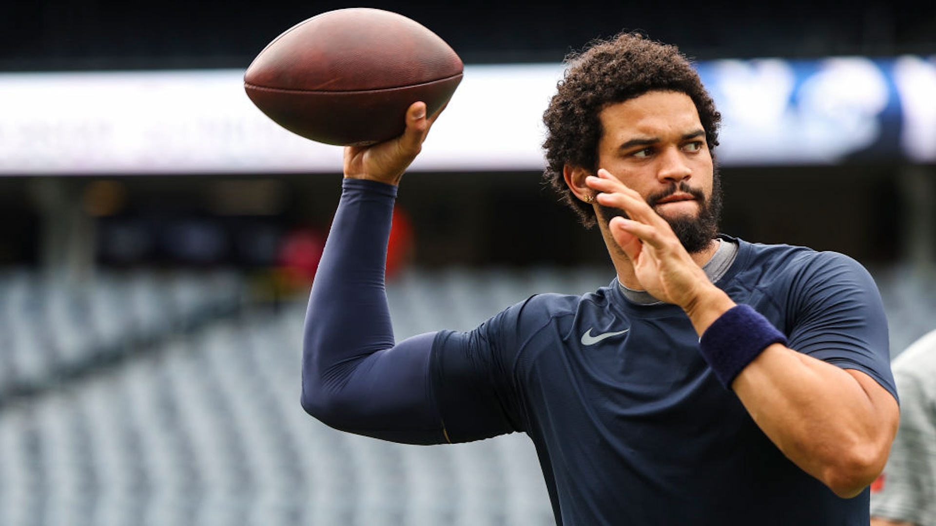 Caleb Williams #18 of the Chicago Bears warms up prior to an NFL football game against the Cincinnati Bengals at Solider Field on August 17, 2024 in Chicago, Illinois.