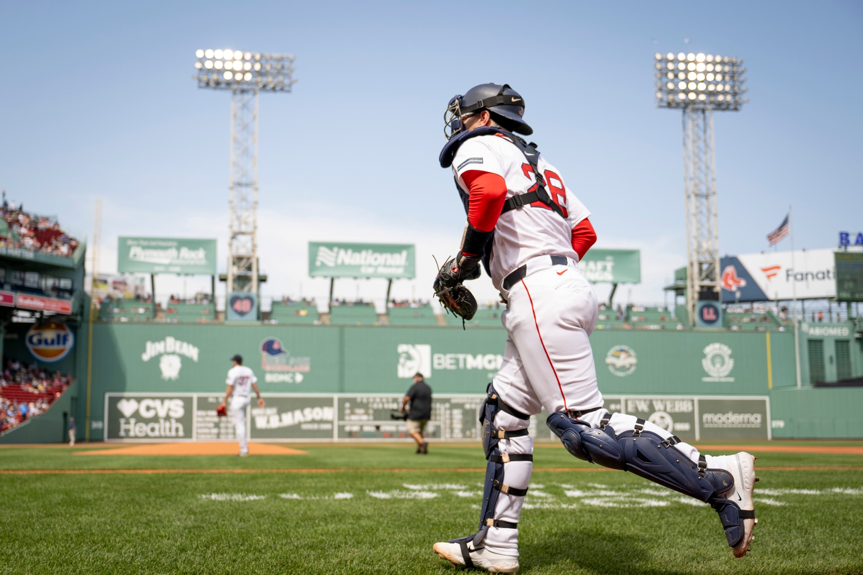 Making MLB history as the first player to play for both teams in the same game, Danny Jansen #28 of the Boston Red Sox takes the field for game one of a doubleheader against the Toronto Blue Jays on August 26, 2024 at Fenway Park in Boston, Massachusetts.