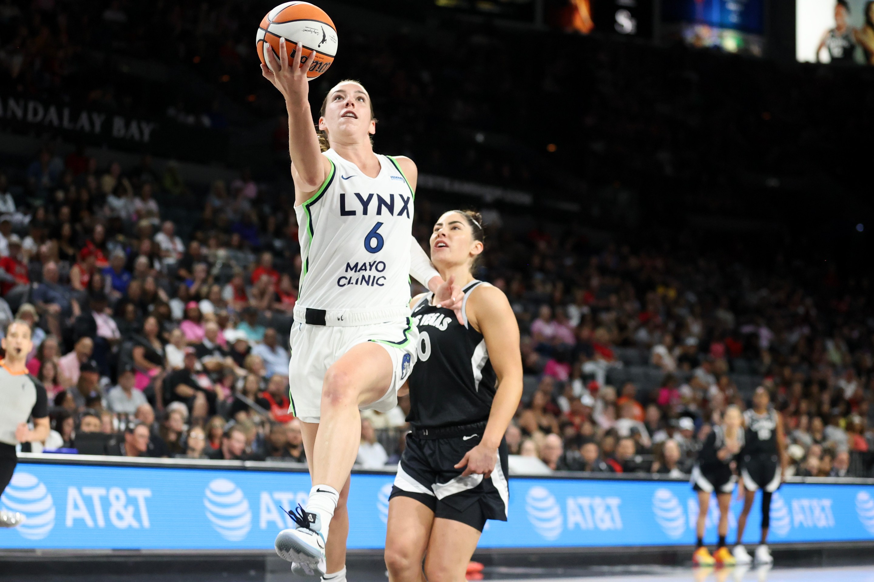 Bridget Carleton #6 of the Minnesota Lynx goes up for a basket past Kelsey Plum #10 of the Las Vegas Aces during the first quarter at Michelob ULTRA Arena on August 21, 2024 in Las Vegas, Nevada.