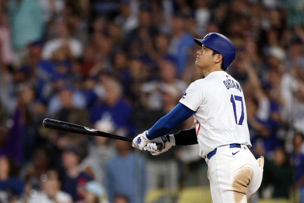 Shohei Ohtani watches the ball after hitting a home run