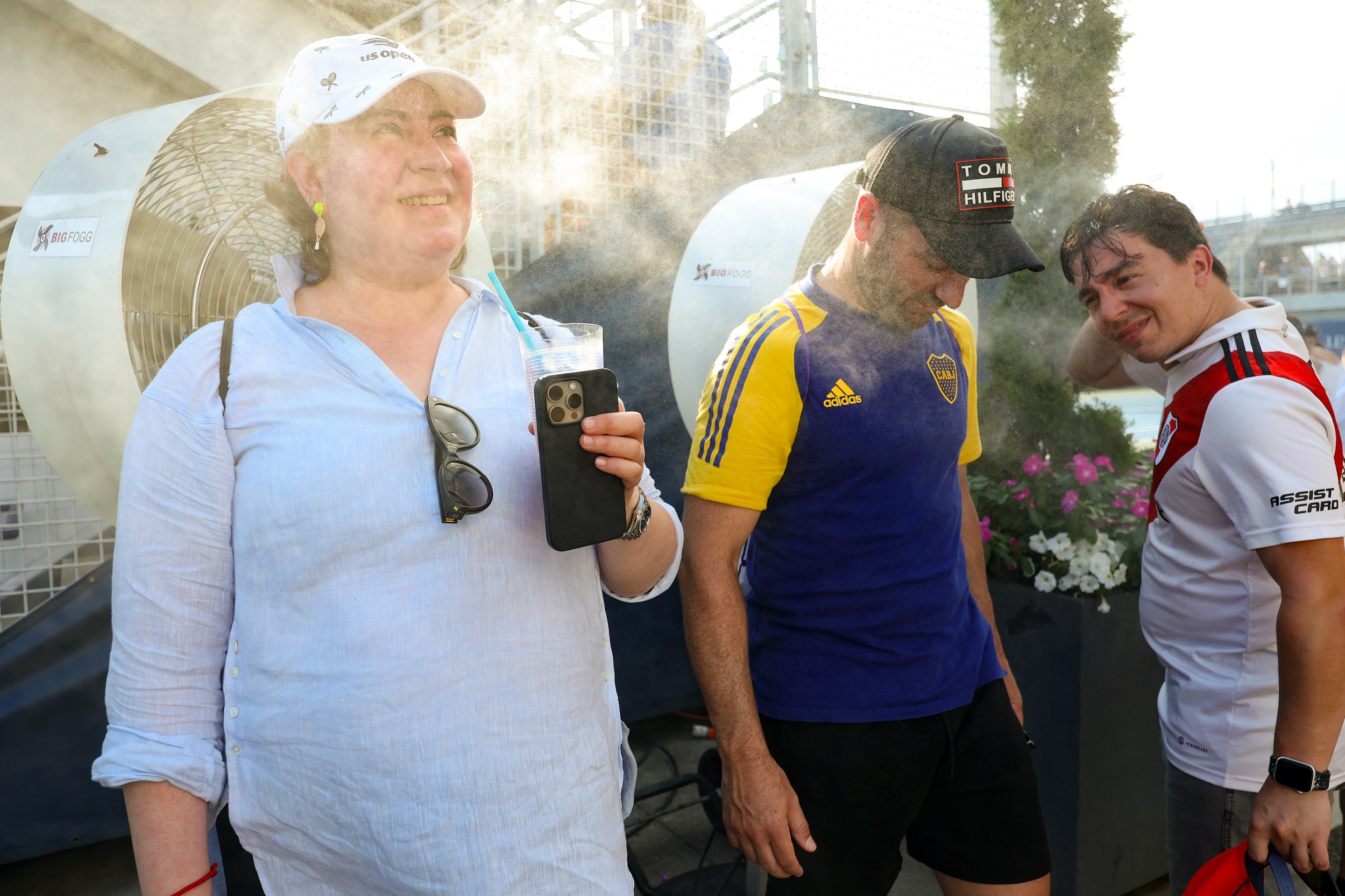 Fans cool off in misters during Day Three of the 2024 US Open at USTA Billie Jean King National Tennis Center on August 28, 2024 in the Flushing neighborhood of the Queens borough of New York City.