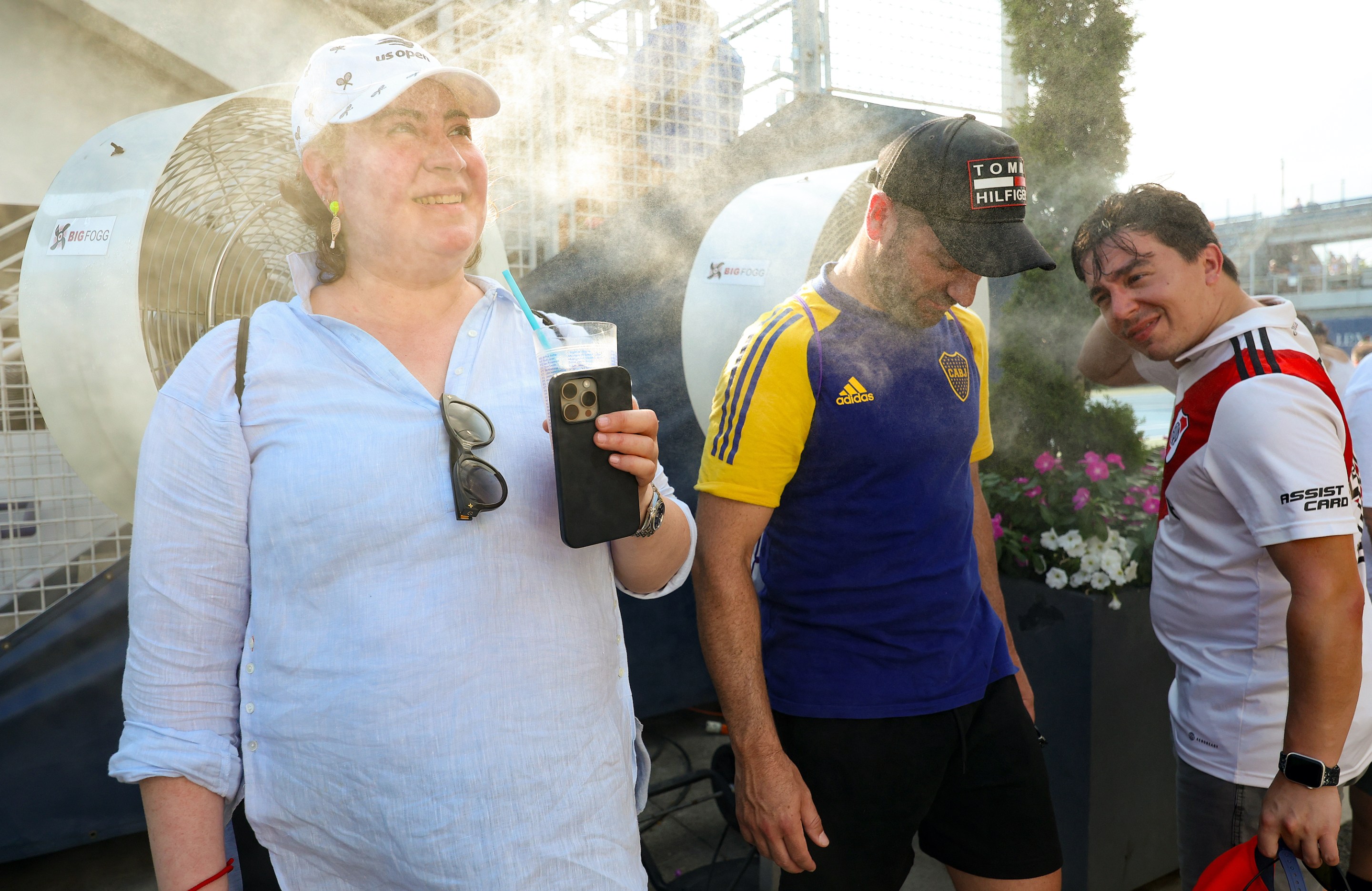 Fans cool off in misters during Day Three of the 2024 US Open at USTA Billie Jean King National Tennis Center on August 28, 2024 in the Flushing neighborhood of the Queens borough of New York City.