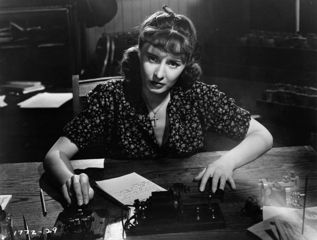 Barbara Stanwyck at a telegraph in 'Union Pacific'