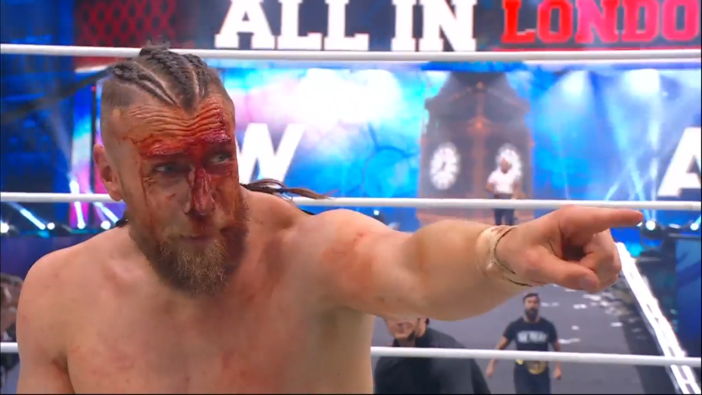 Bryan Danielson, bloody and pointing in the ring