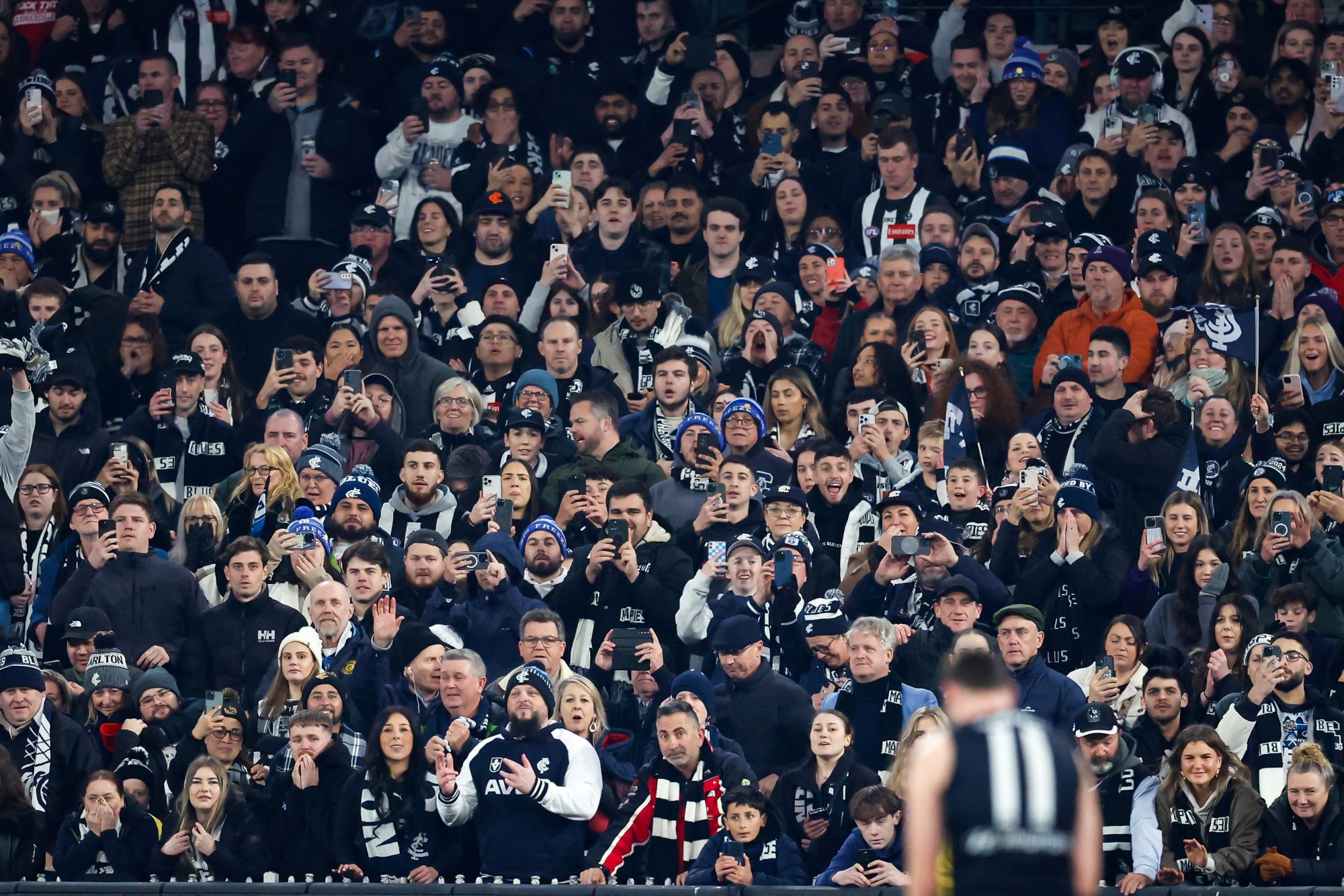 A packed crowd at the Melbourne Cricket Grounds awaits a fateful kick from Carlton's Mitch McGovern.