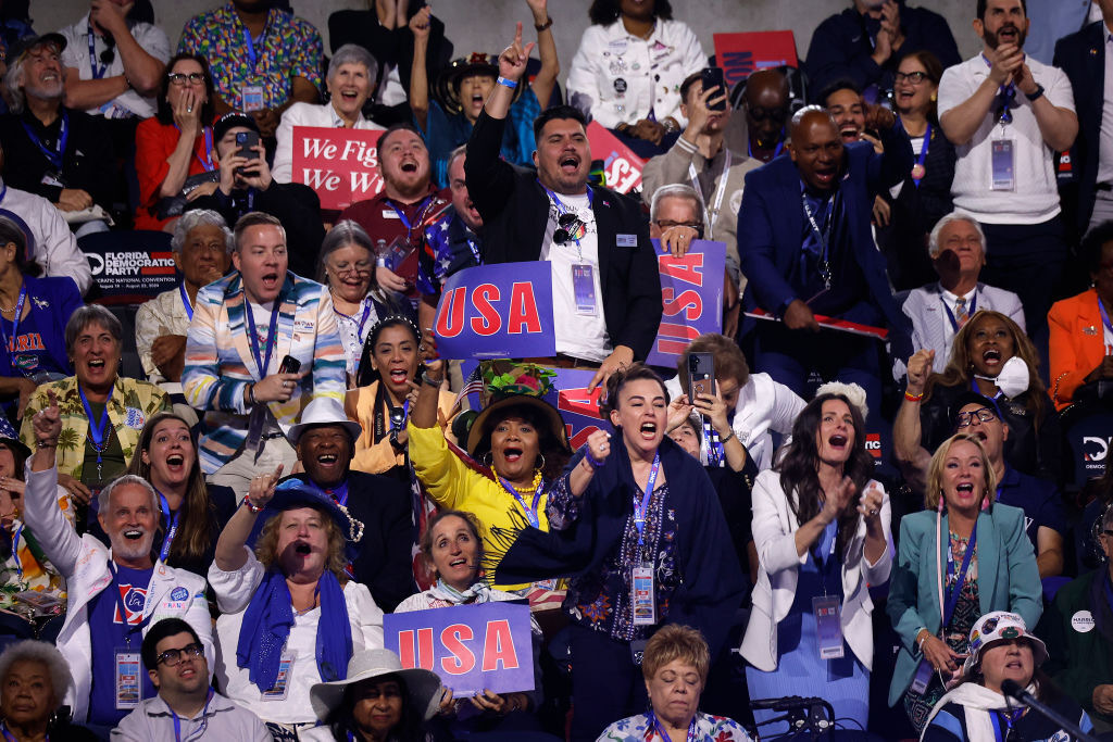 CHICAGO, ILLINOIS - AUGUST 19: Delegates from Florida chant "Lock him up," as Hillary Clinton talks about former President Donald Trump's criminal convictions during the first day of the Democratic National Convention at the United Center on August 19, 2024 in Chicago, Illinois.