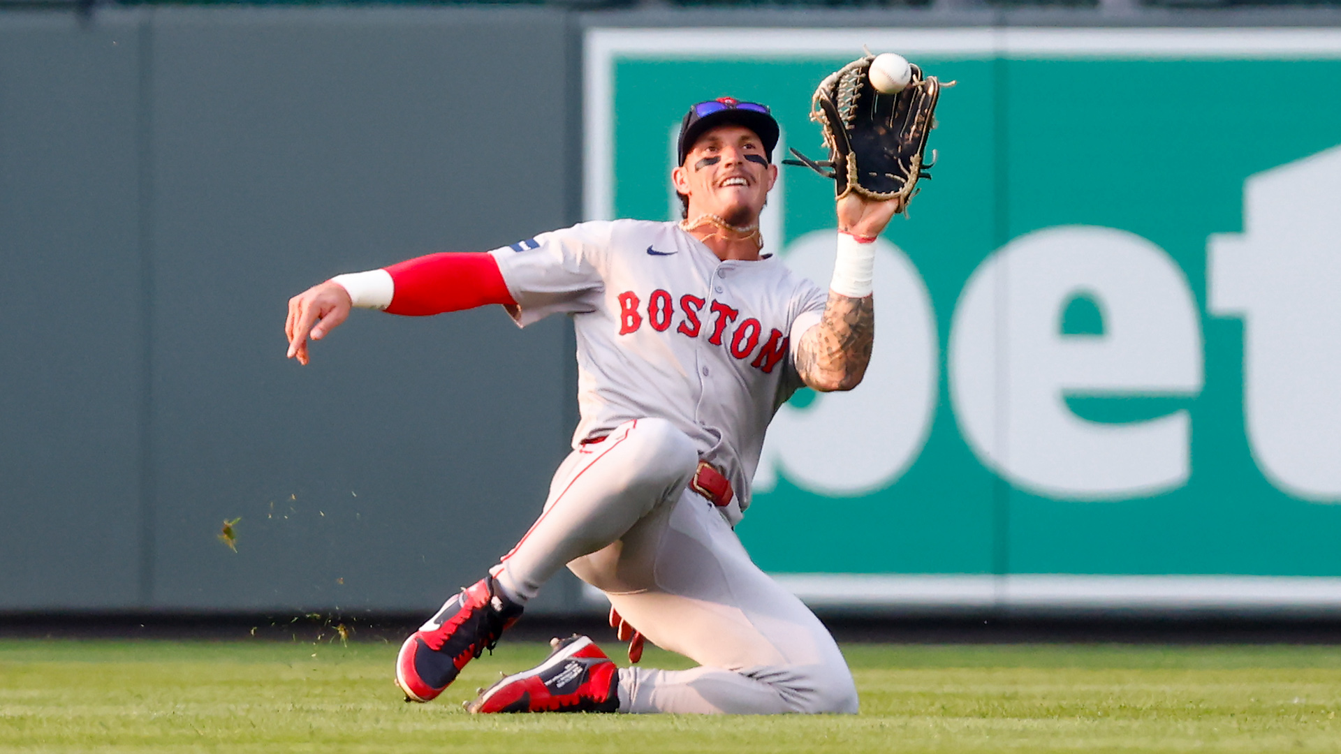 Jarren Duran #16 of the Boston Red Sox catches a fly ball during the first inning against the Colorado Rockies.