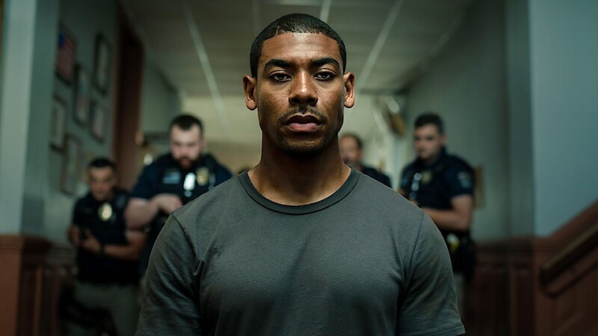 Aaron Pierre's character in Rebel Ridge, surrounded by police