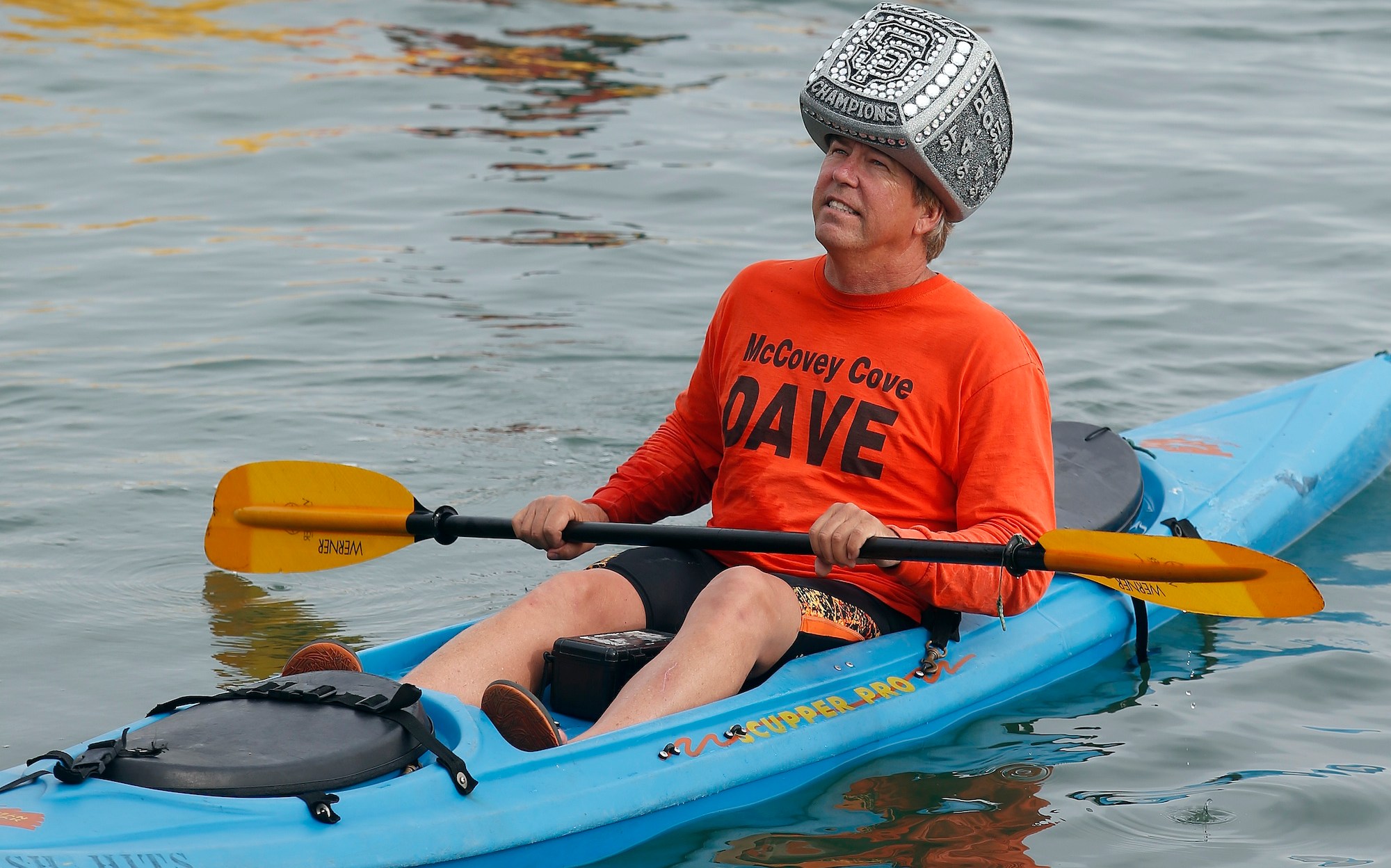 San Francisco Giants fan "McCovey Dave" Edlund, of Los Altos, wears a World Series ring on his head in McCovey Cove before Game 4 of the National League baseball championship series against the St. Louis Cardinals at AT&amp;T Park in San Francisco, Calif., on Wednesday, Oct. 15, 2014. (Jane Tyska/Bay Area News Group)