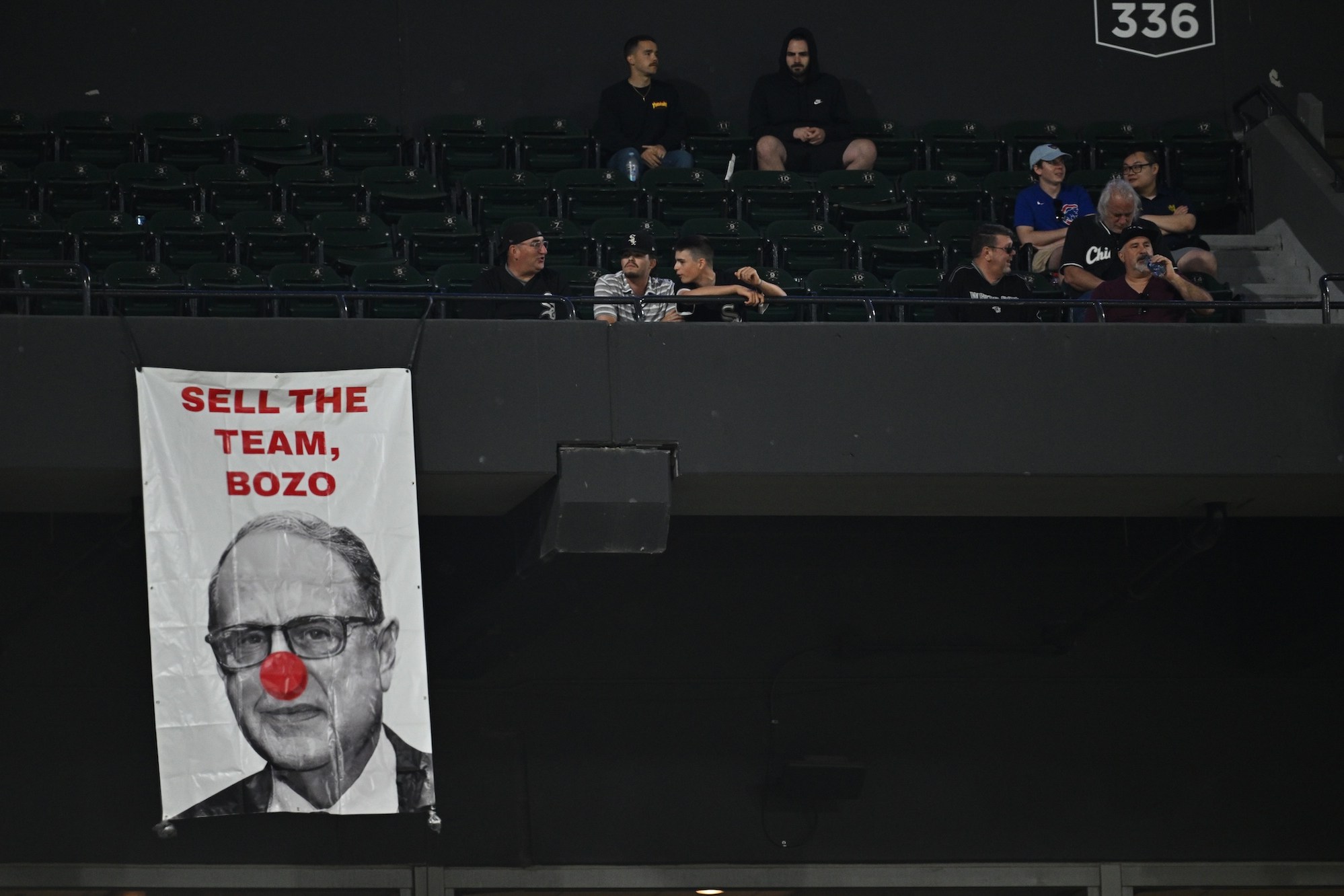CHICAGO, IL - MAY 23: A sign depicting Chicago White Sox owner Jerry Reinsdorf hangs from the upper deck during the ninth inning of a game between the Baltimore Orioles and Chicago White Sox at Guaranteed Rate Field on May 23, 2024 in Chicago, Illinois. Baltimore defeated Chicago 8-6. (Photo by Jamie Sabau/Getty Images)