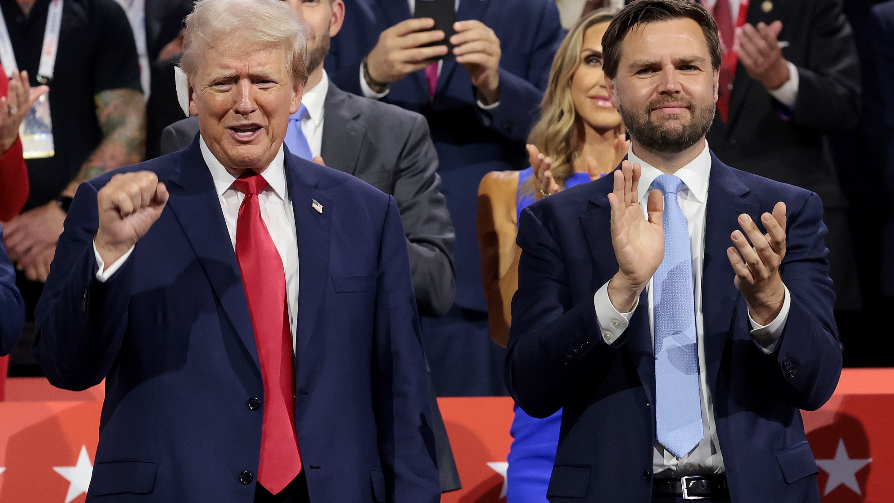 Republican presidential candidate, former U.S. President Donald Trump (L) and Republican vice presidential candidate, U.S. Sen. J.D. Vance (R-OH) appear on the first day of the Republican National Convention at the Fiserv Forum on July 15, 2024 in Milwaukee, Wisconsin. Delegates, politicians, and the Republican faithful are in Milwaukee for the annual convention, concluding with former President Donald Trump accepting his party's presidential nomination