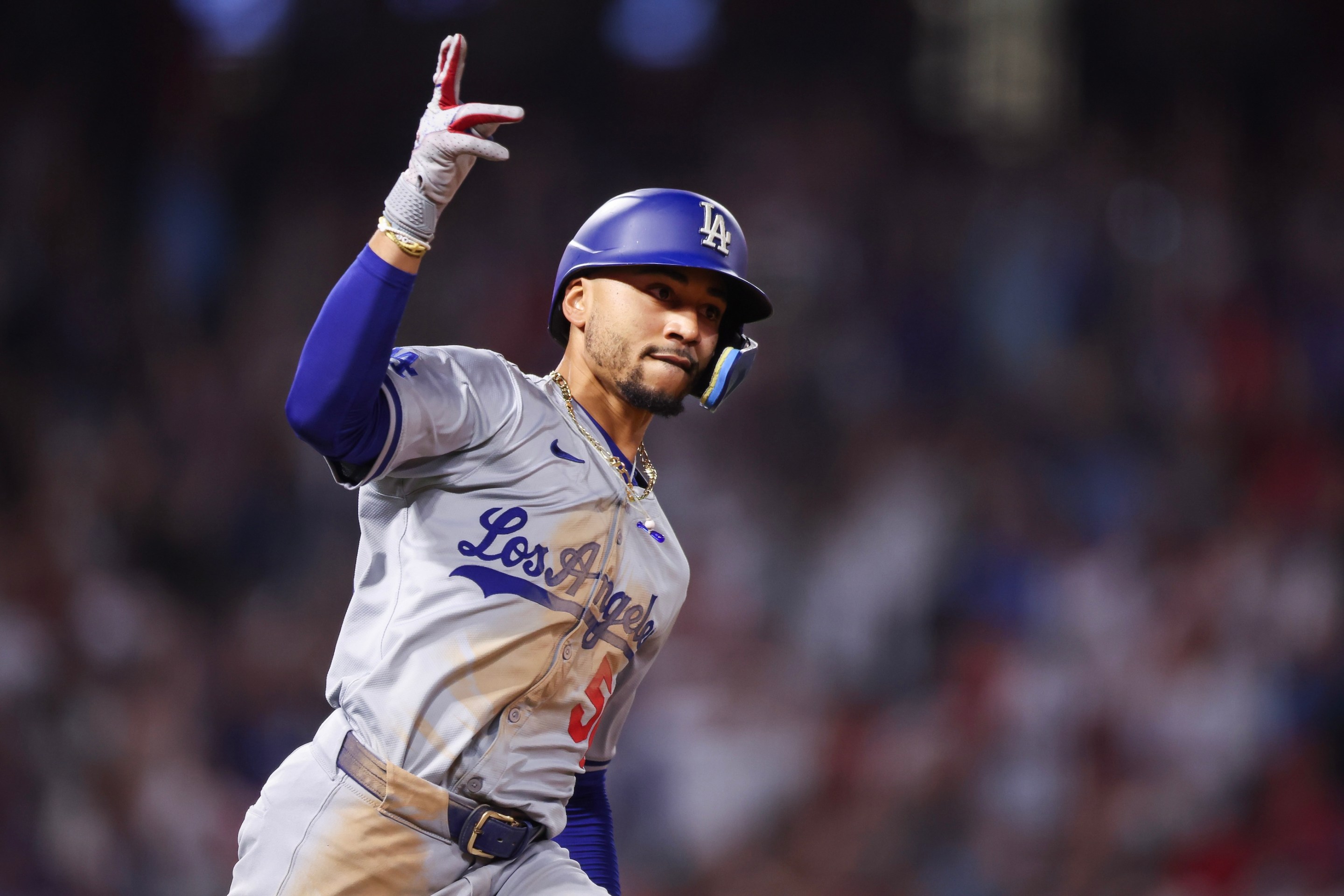 Mookie Betts of the Los Angeles Dodgers reacts after hitting a three run home run in the tenth inning against the Los Angeles Angels.