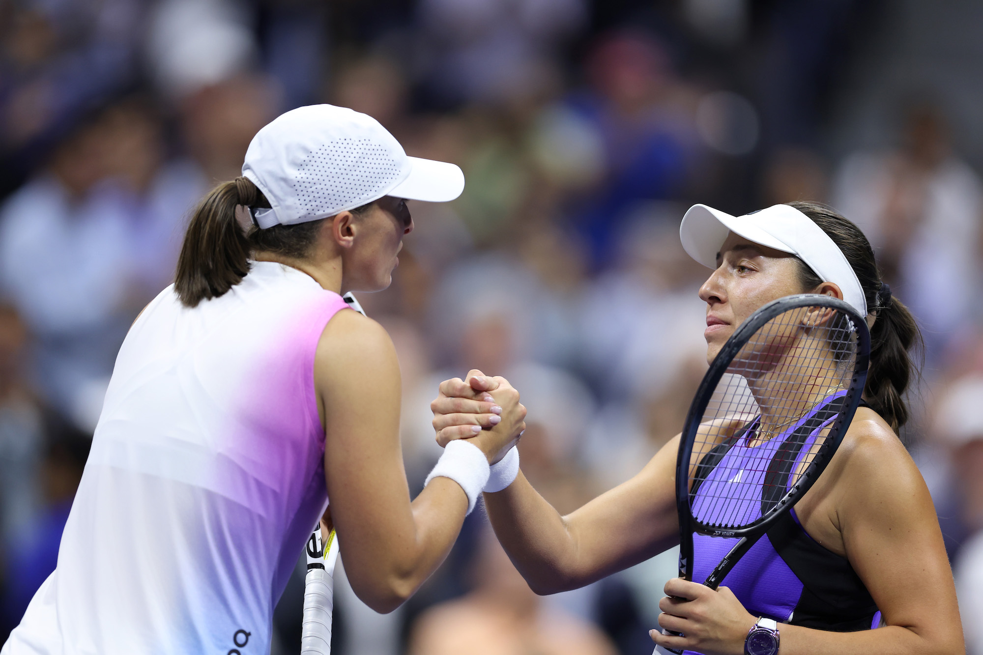 NEW YORK, NEW YORK - SEPTEMBER 04: Jessica Pegula (R) of the United States shakes hands after defeating Iga Swiatek of Poland during their Women's Singles Quarterfinal match on Day Ten of the 2024 US Open at USTA Billie Jean King National Tennis Center on September 04, 2024 in the Flushing neighborhood of the Queens borough of New York City. (Photo by Al Bello/Getty Images)