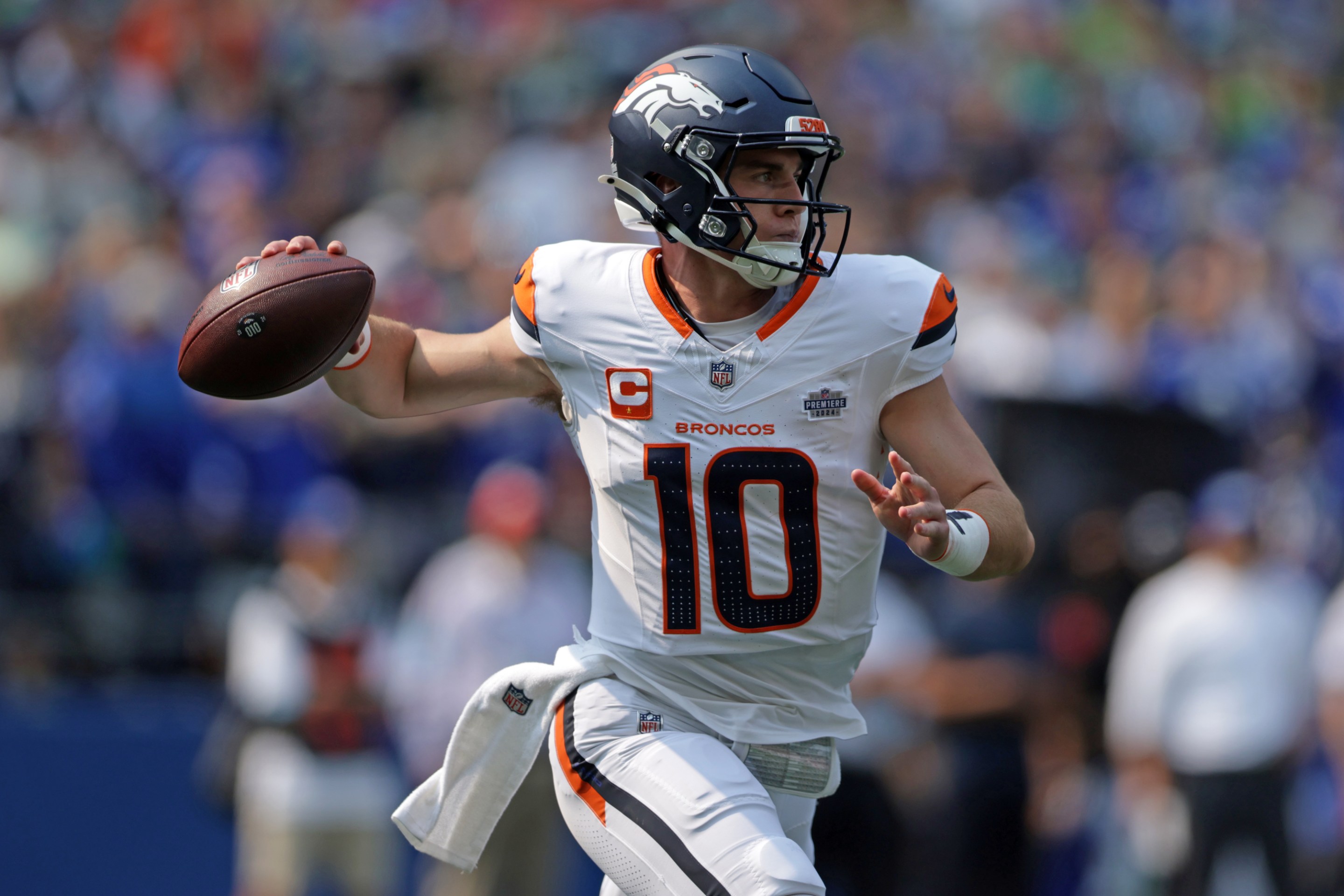 Bo Nix #10 of the Denver Broncos attempts a pass during the first quarter against the Seattle Seahawks at Lumen Field on September 08, 2024 in Seattle, Washington.