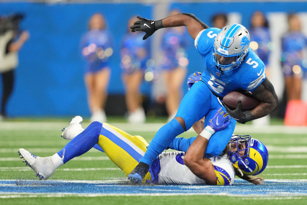 David Montgomery with his knee on top of a tackler